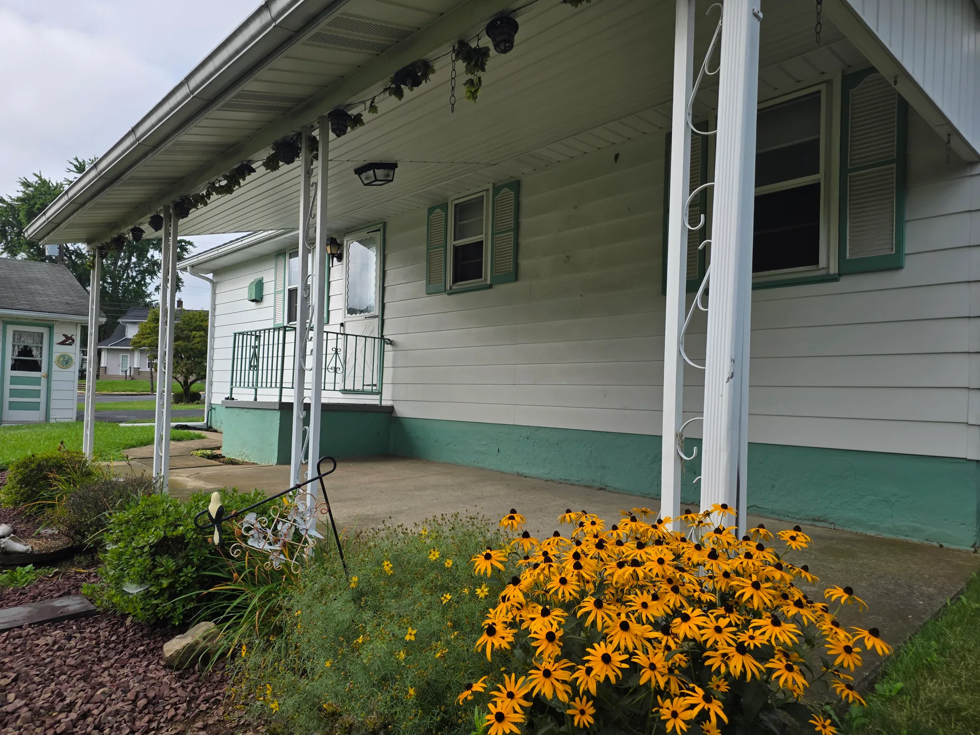Covered front porch with decorative columns
