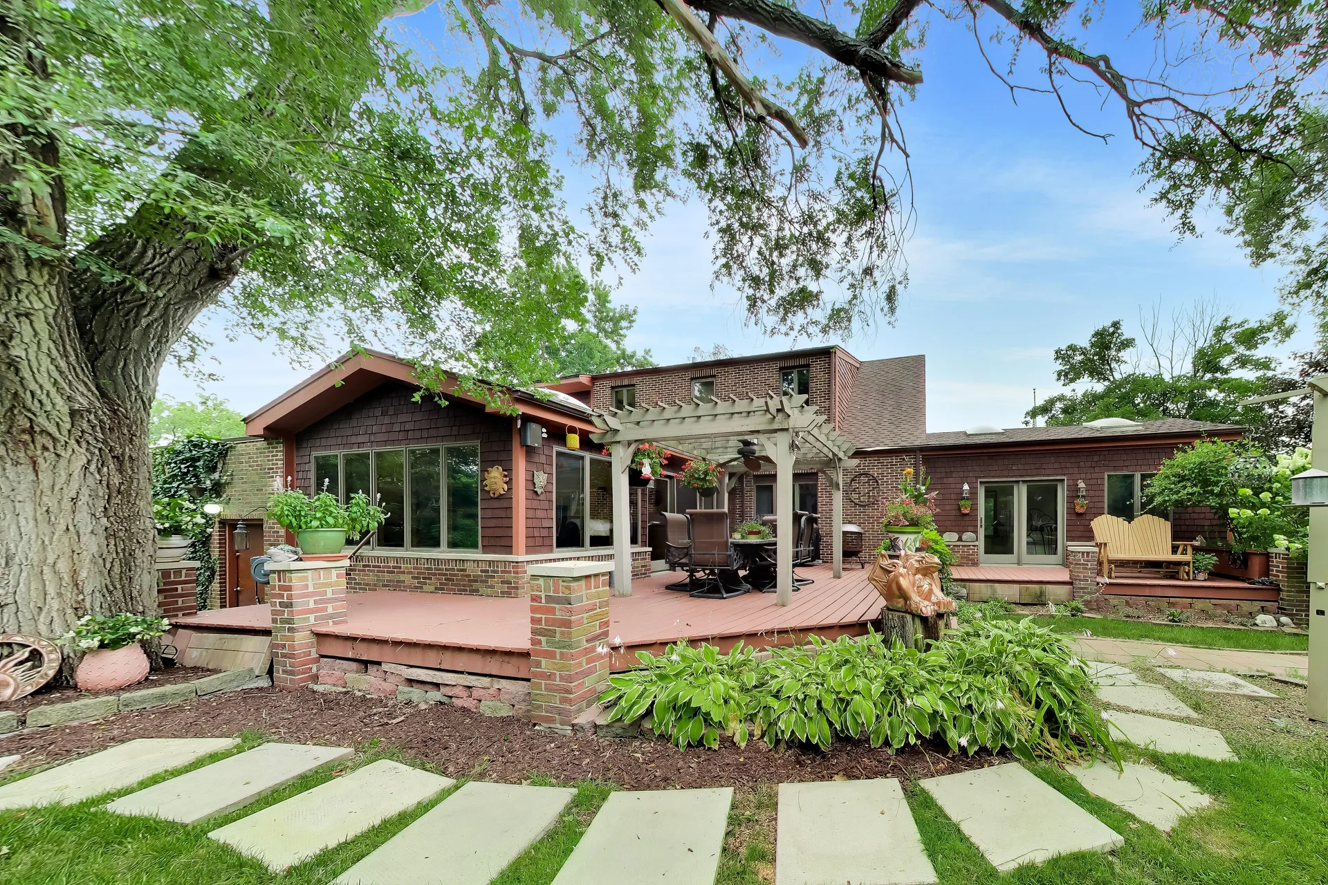 Large deck and pergola facing the yard
