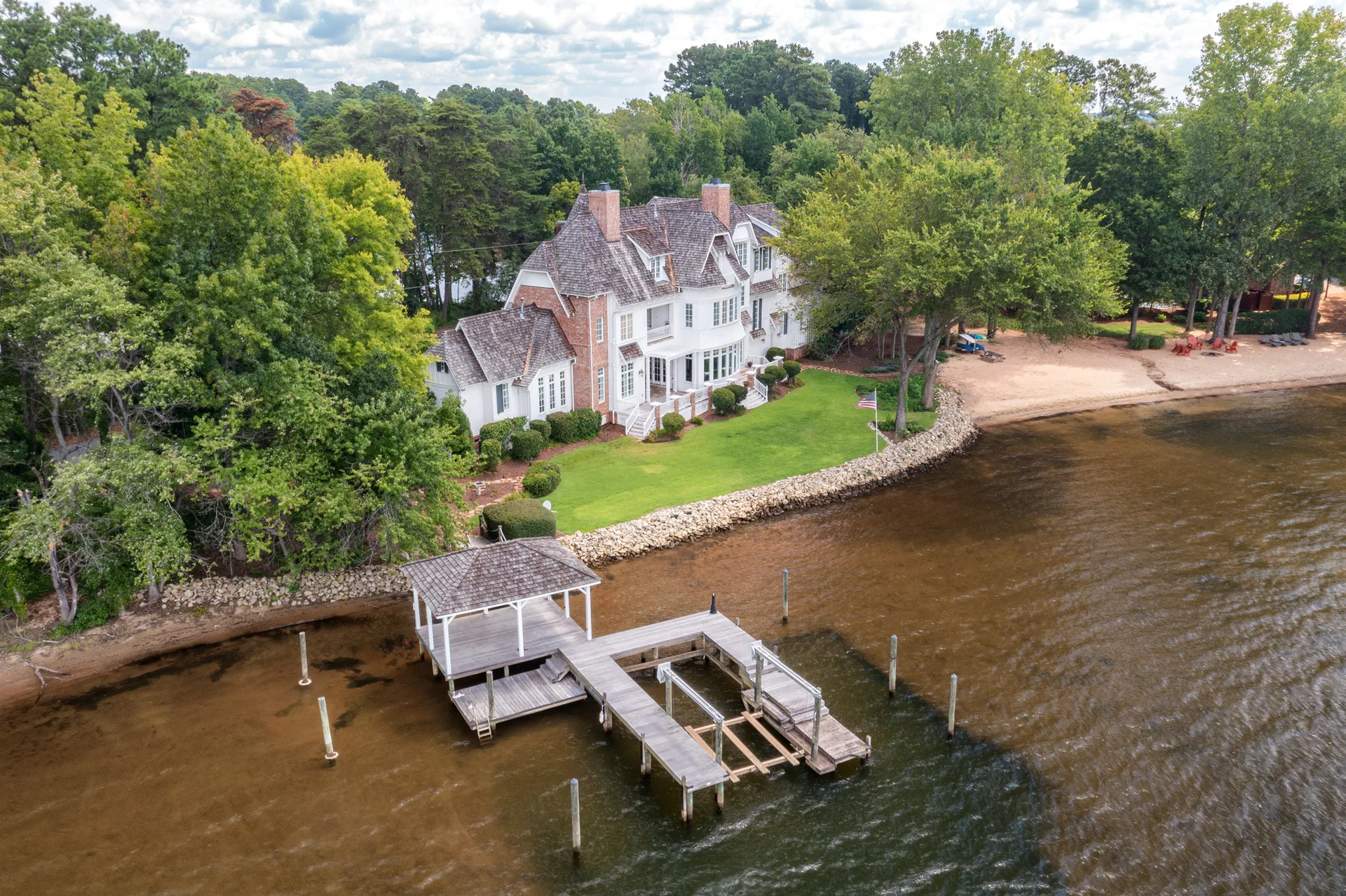 Aerial view showing house, dock, and shoreline