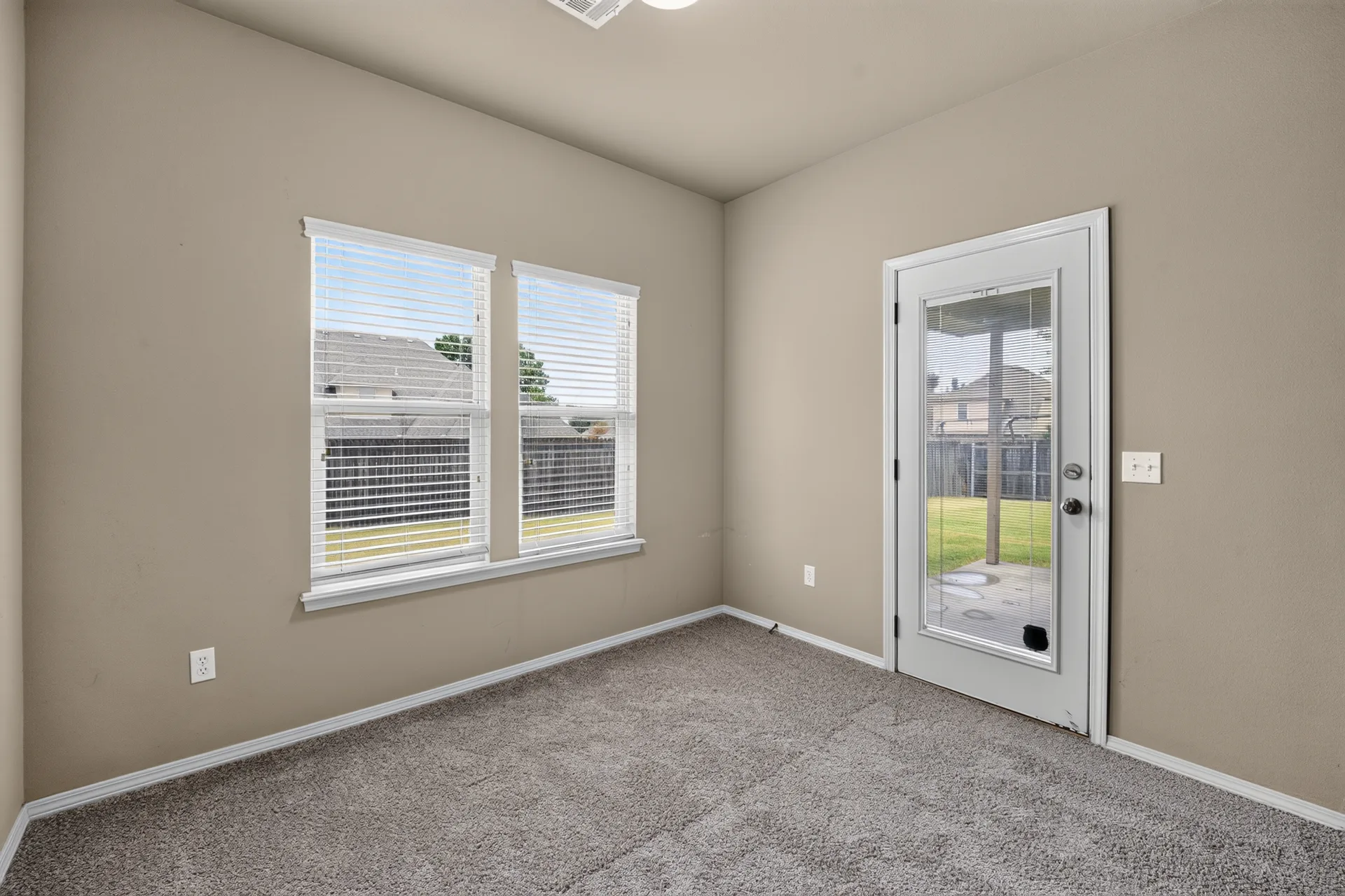 Bedroom with door to the covered patio