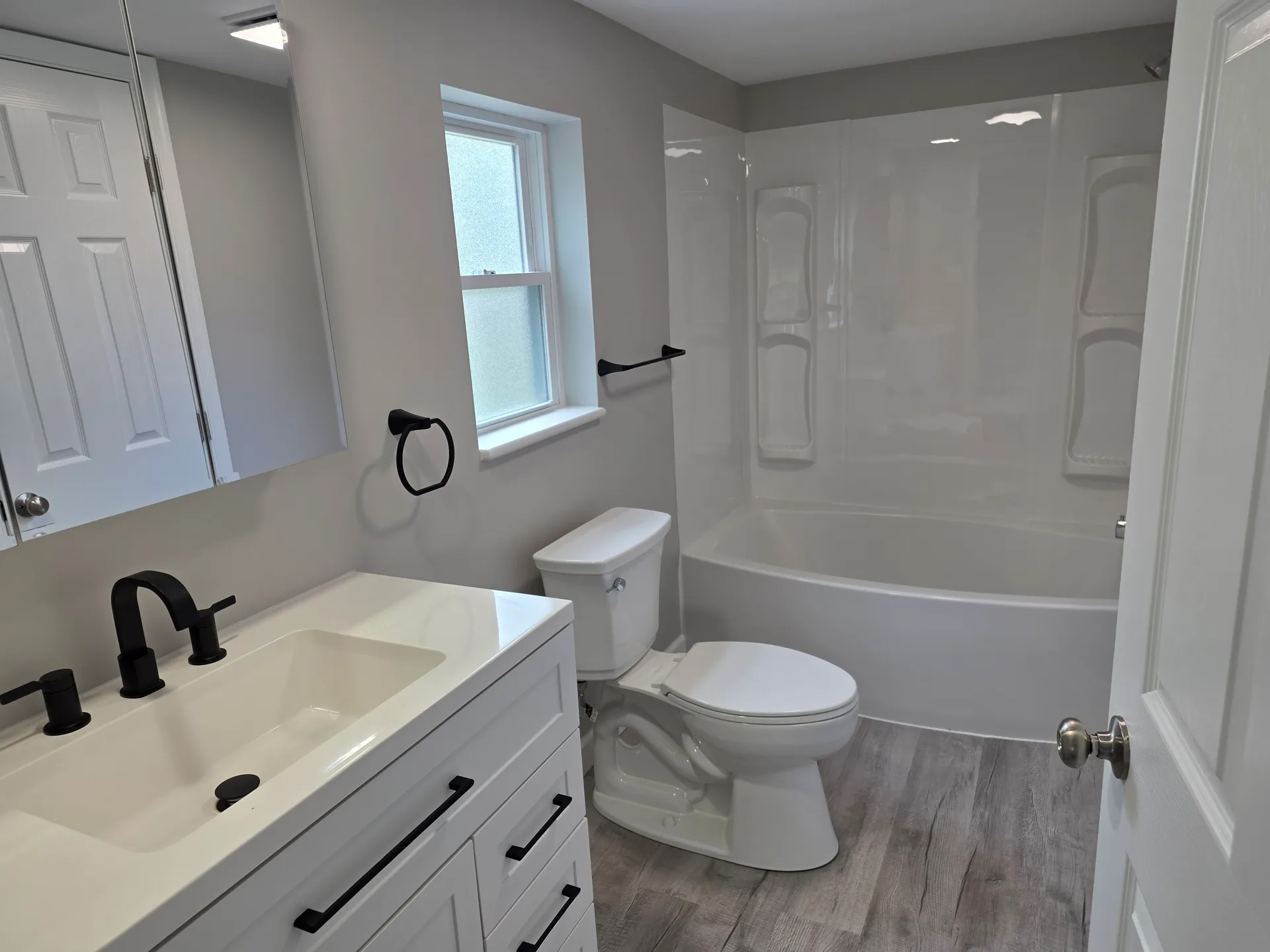 Modern bathroom vanity with black hardware