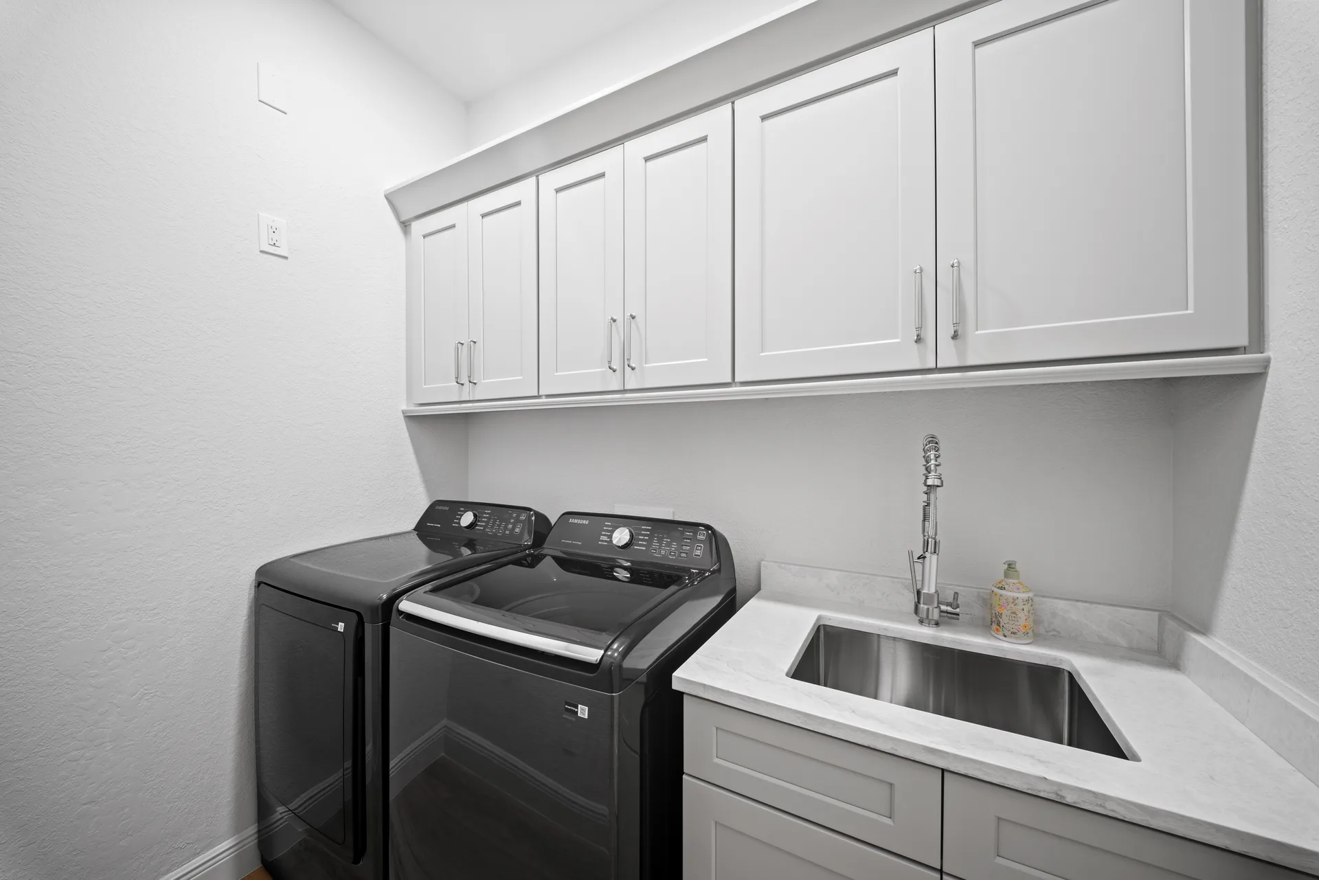 Modern laundry room at 878 Vistana Circle Naples FL