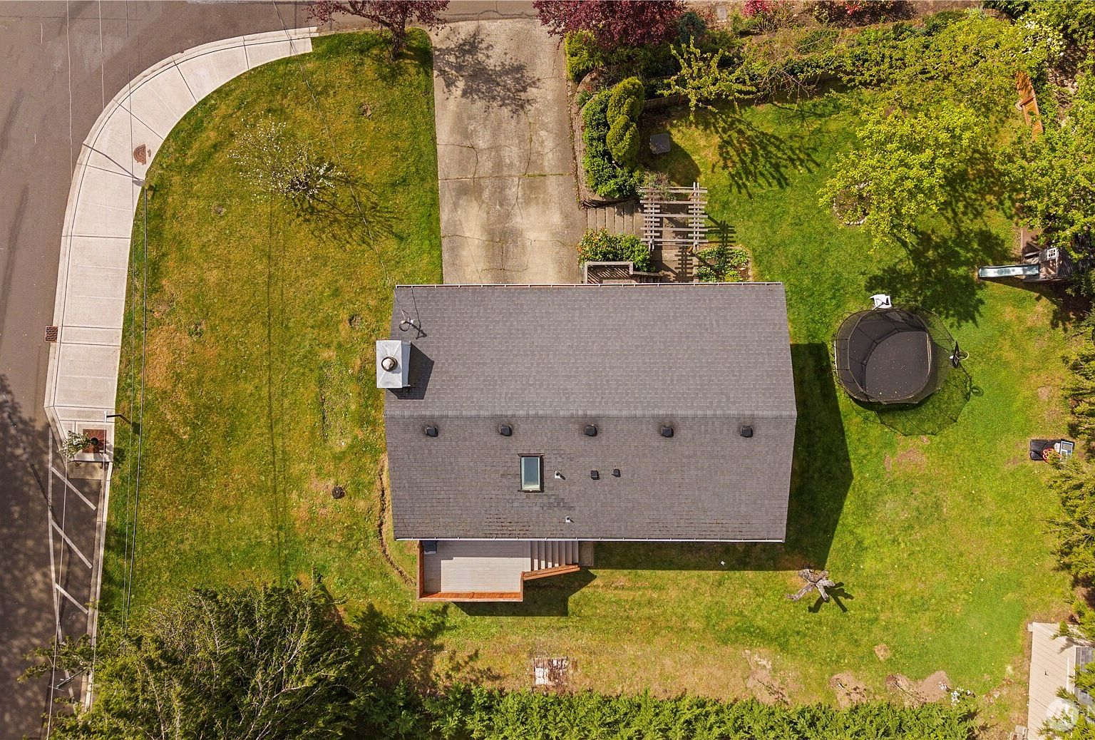 Overhead aerial view showing the property lot and surrounding tree-lined streets