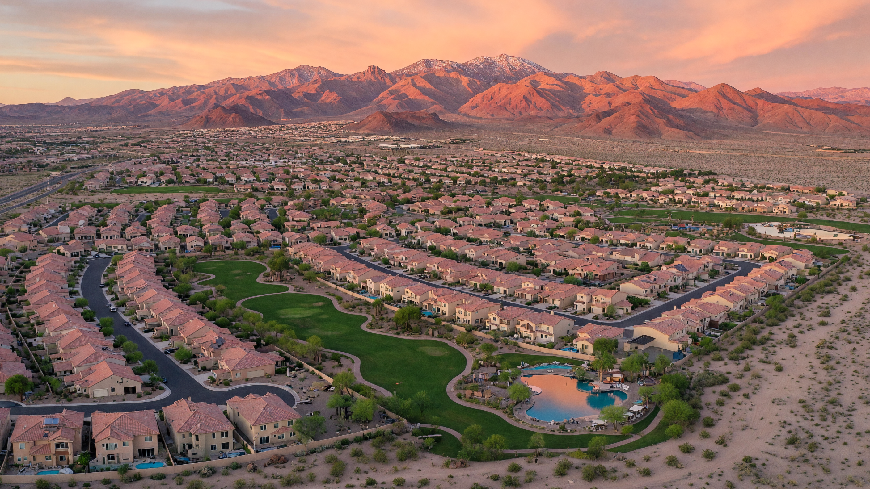 Aerial view of Henderson Nevada master-planned communities with desert mountains at golden hour