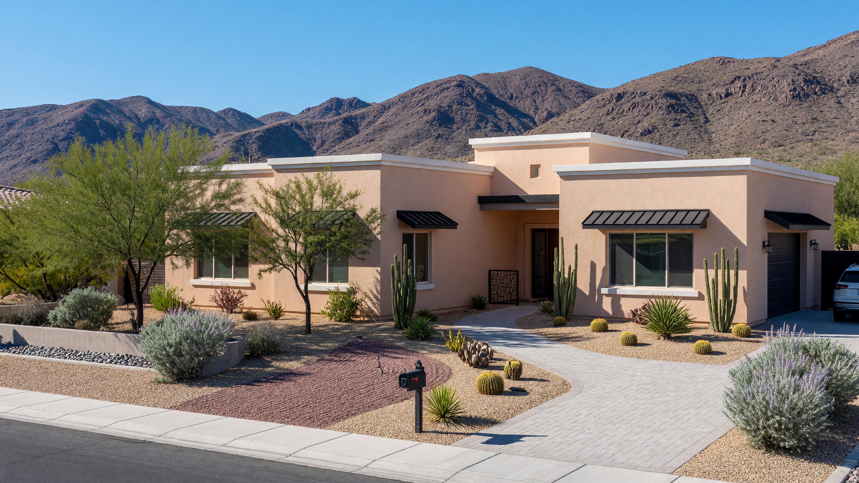A modern Las Vegas suburban home with desert landscaping under a clear blue sky