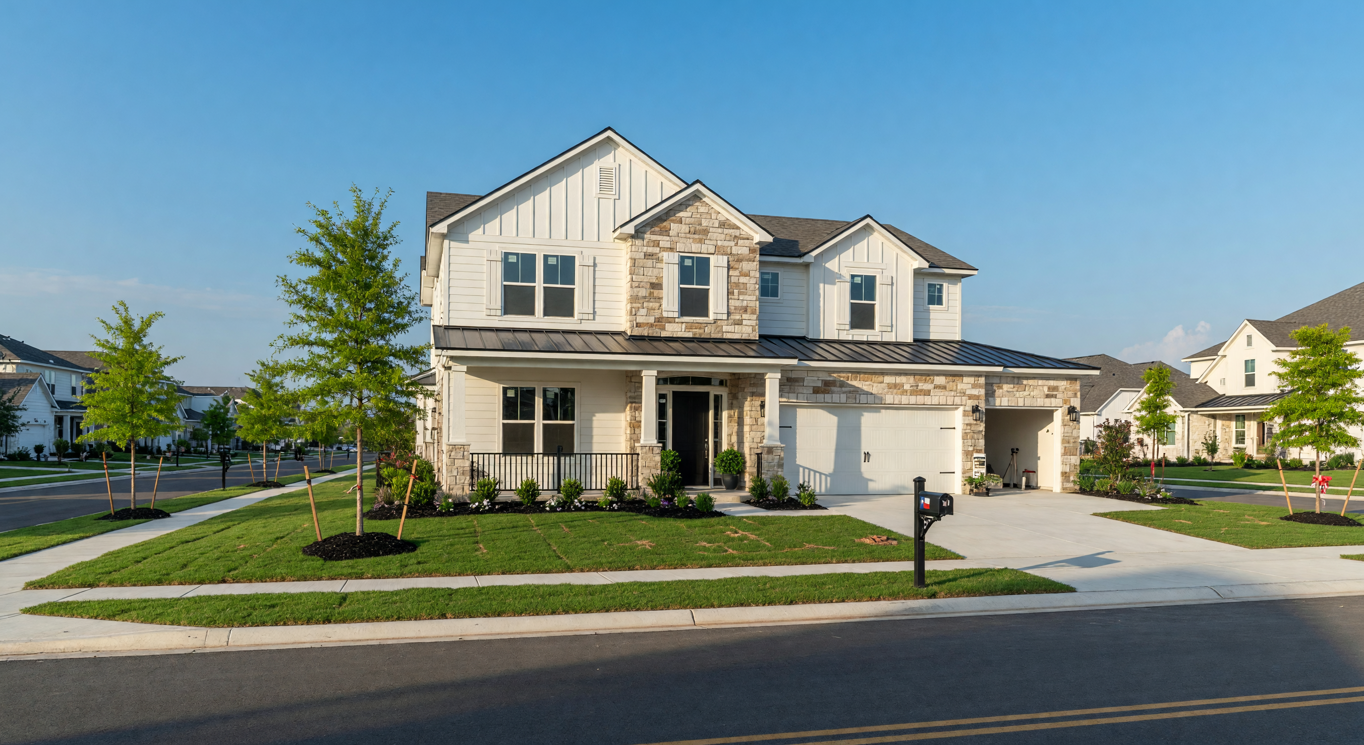 A newly constructed modern farmhouse style home in a Northeast Texas master-planned community with fresh landscaping and a clear blue sky