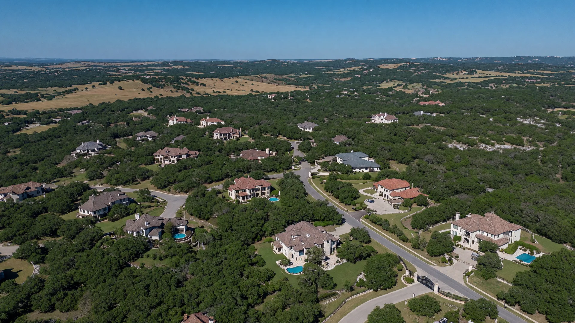 Established residential neighborhood in the Texas Hill Country with mature live oak trees, generous lots, and traditional homes near Boerne Texas