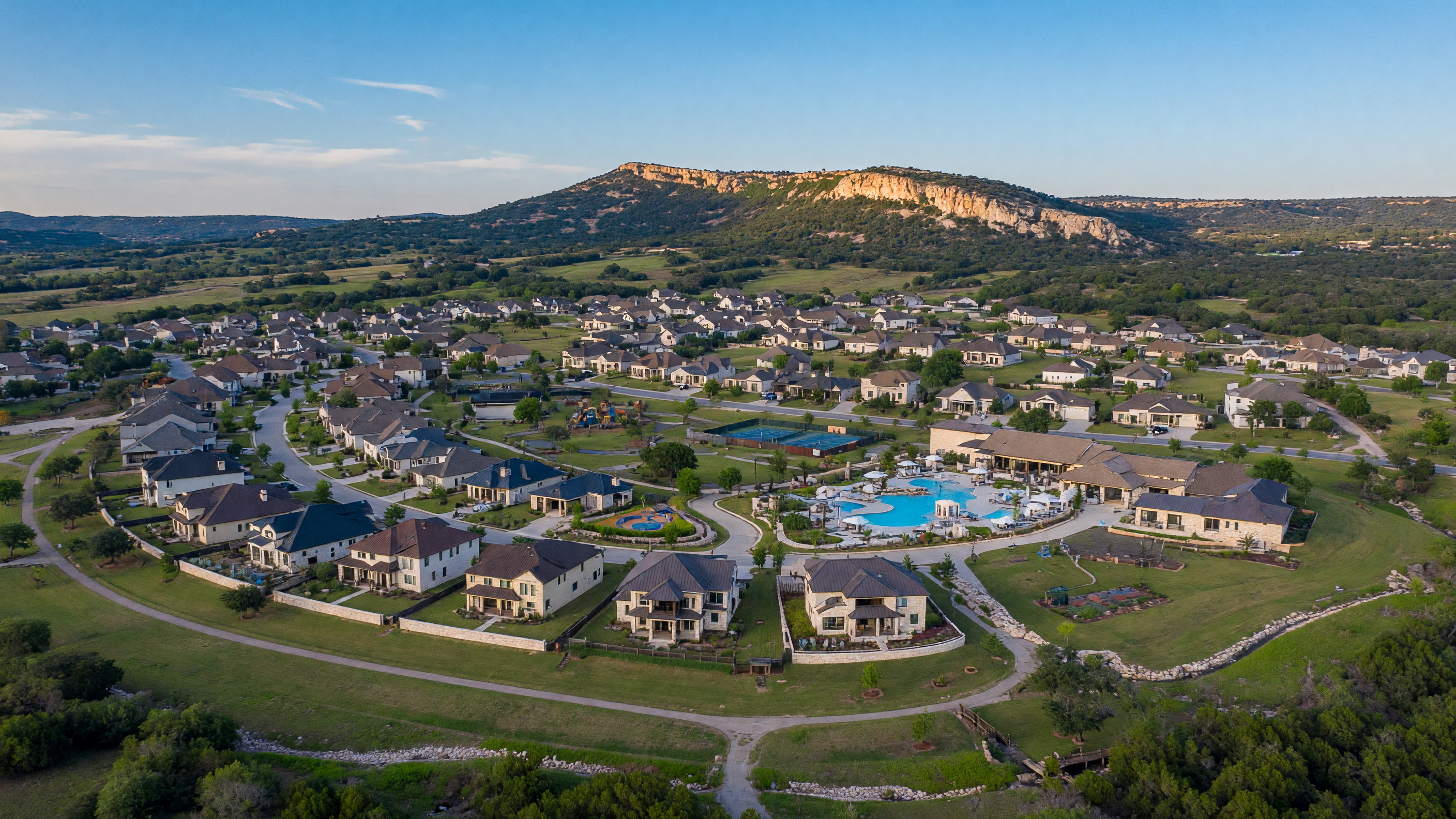 Aerial view of the Esperanza master-planned community in Boerne Texas with Hill Country homes, amenity center, and rolling terrain