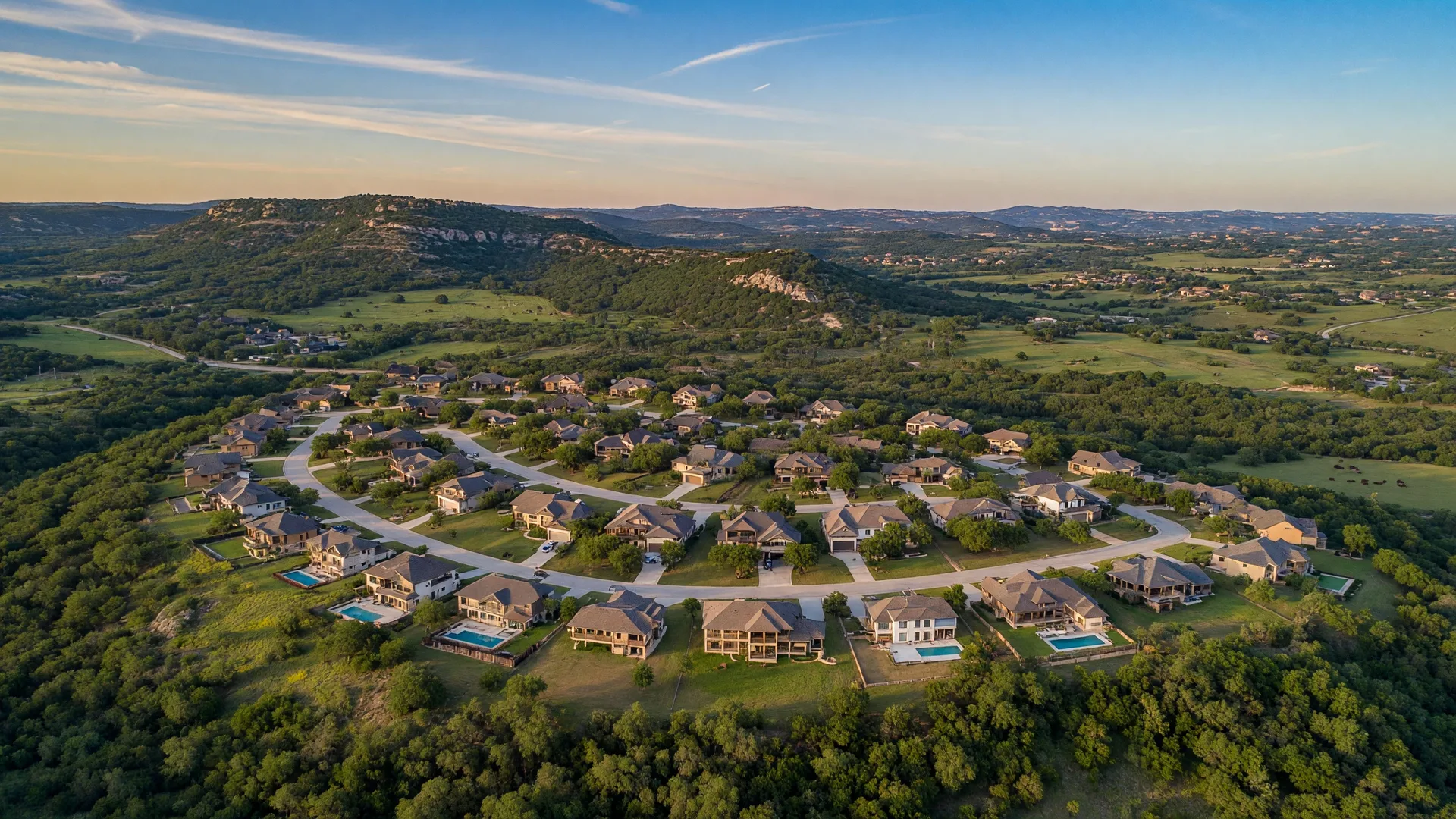 Aerial view of Regent Park master-planned community in Boerne Texas with organized streets, walking trails, green spaces, and Hill Country terrain