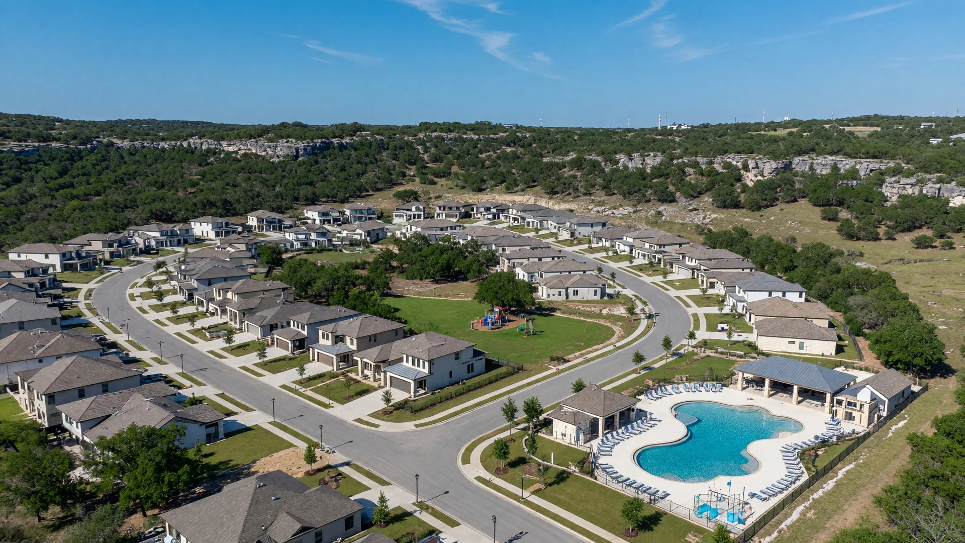 Custom estate homes in The Woods at Fair Oaks Ranch beneath mature oak canopies with generous lots and Hill Country terrain near Boerne Texas