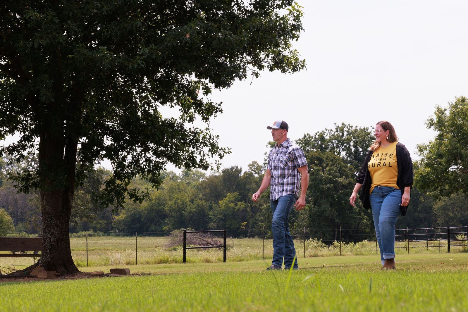 Shannon and Scott Miles walking on rural property