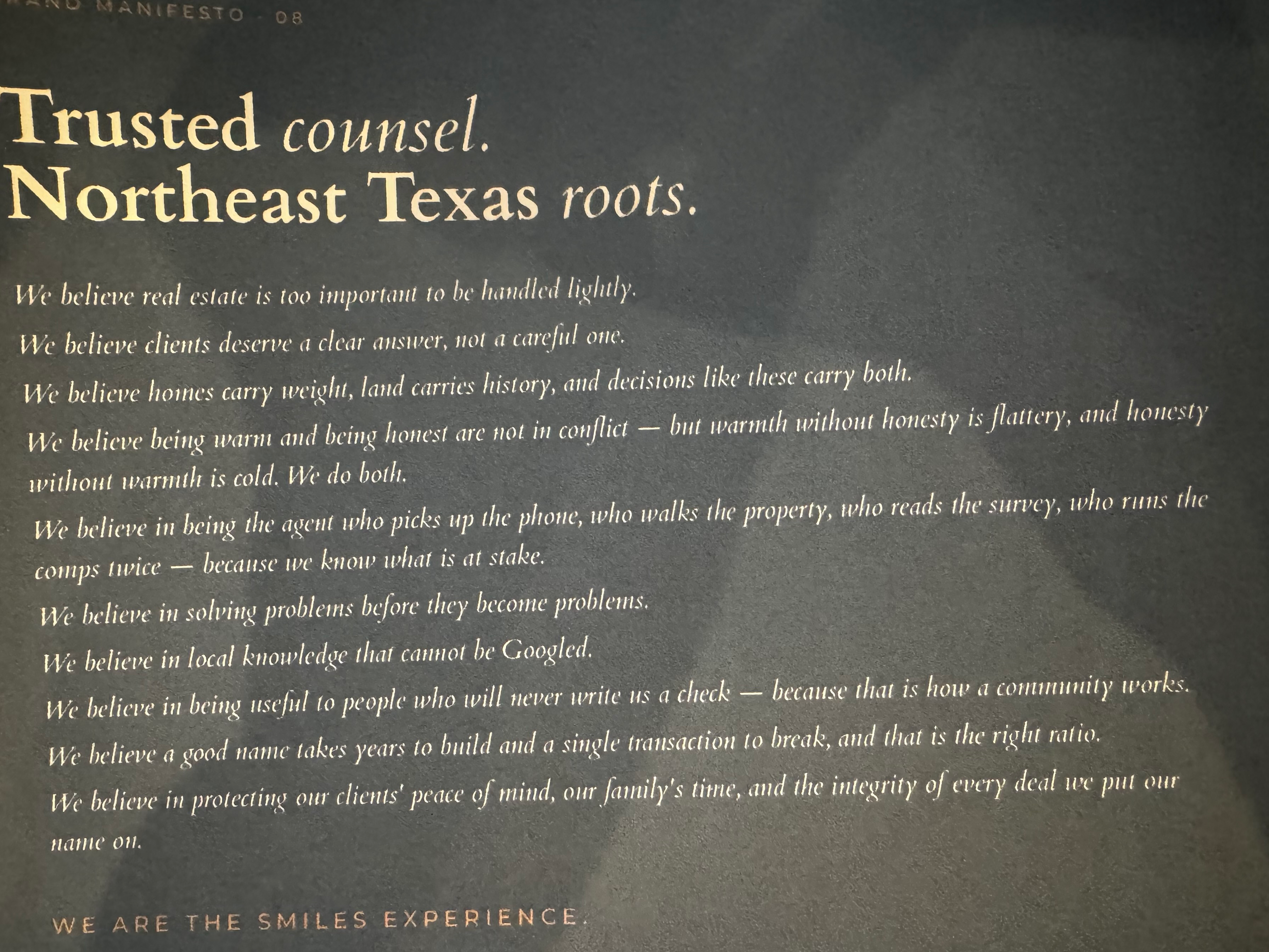 The Shannon Miles Group manifesto printed in white and gold on dark slate