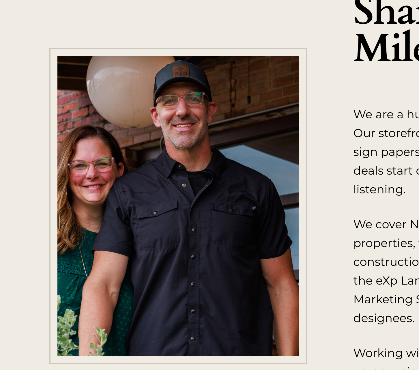 Shannon and Scott Miles of the Shannon Miles Group standing together outside their Paris, TX office