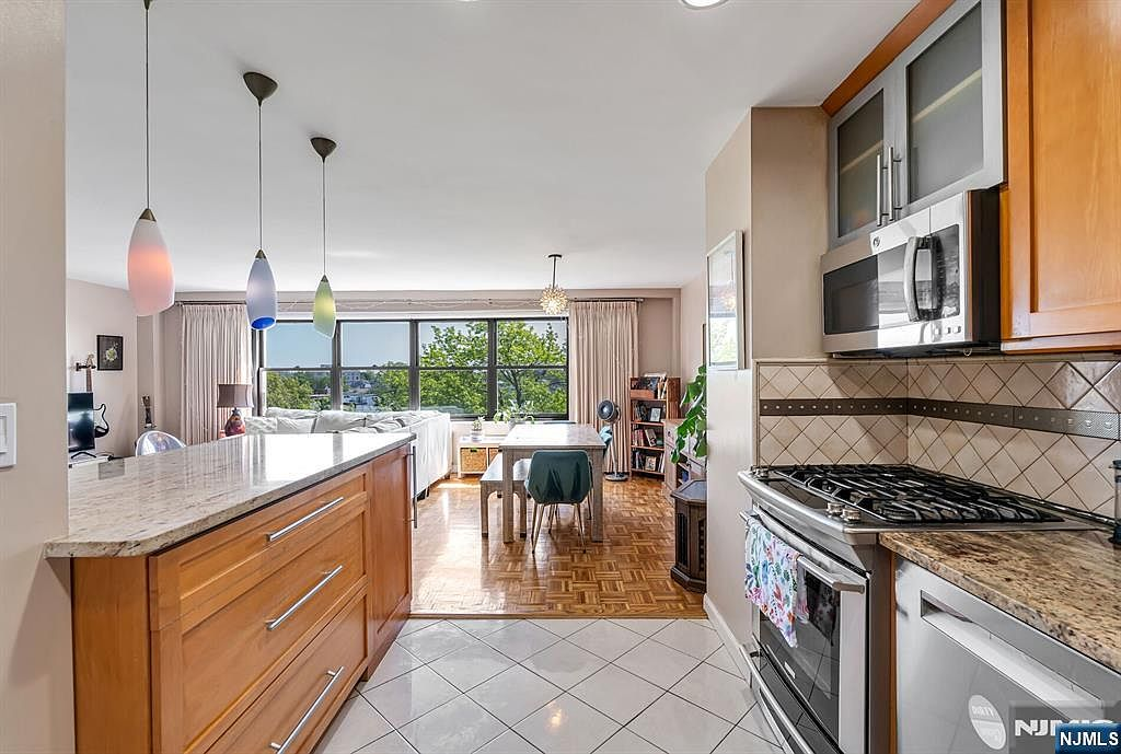 Kitchen view over granite bar to living areas