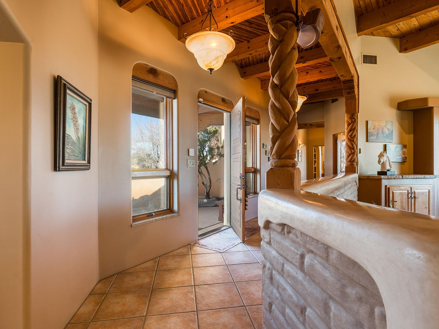 Interior entryway looking through the open front door