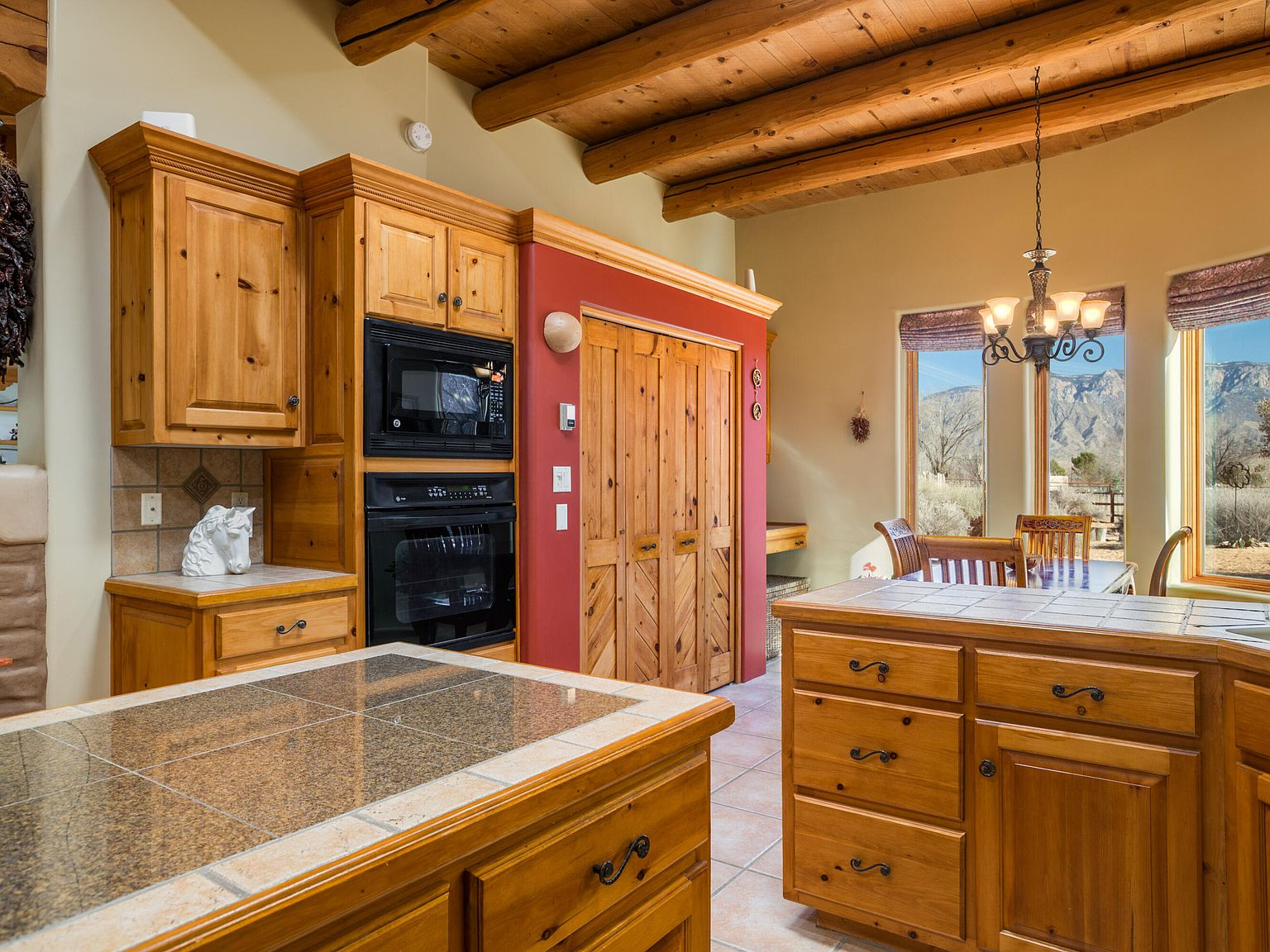 Kitchen and dining area with mountain views through the windows