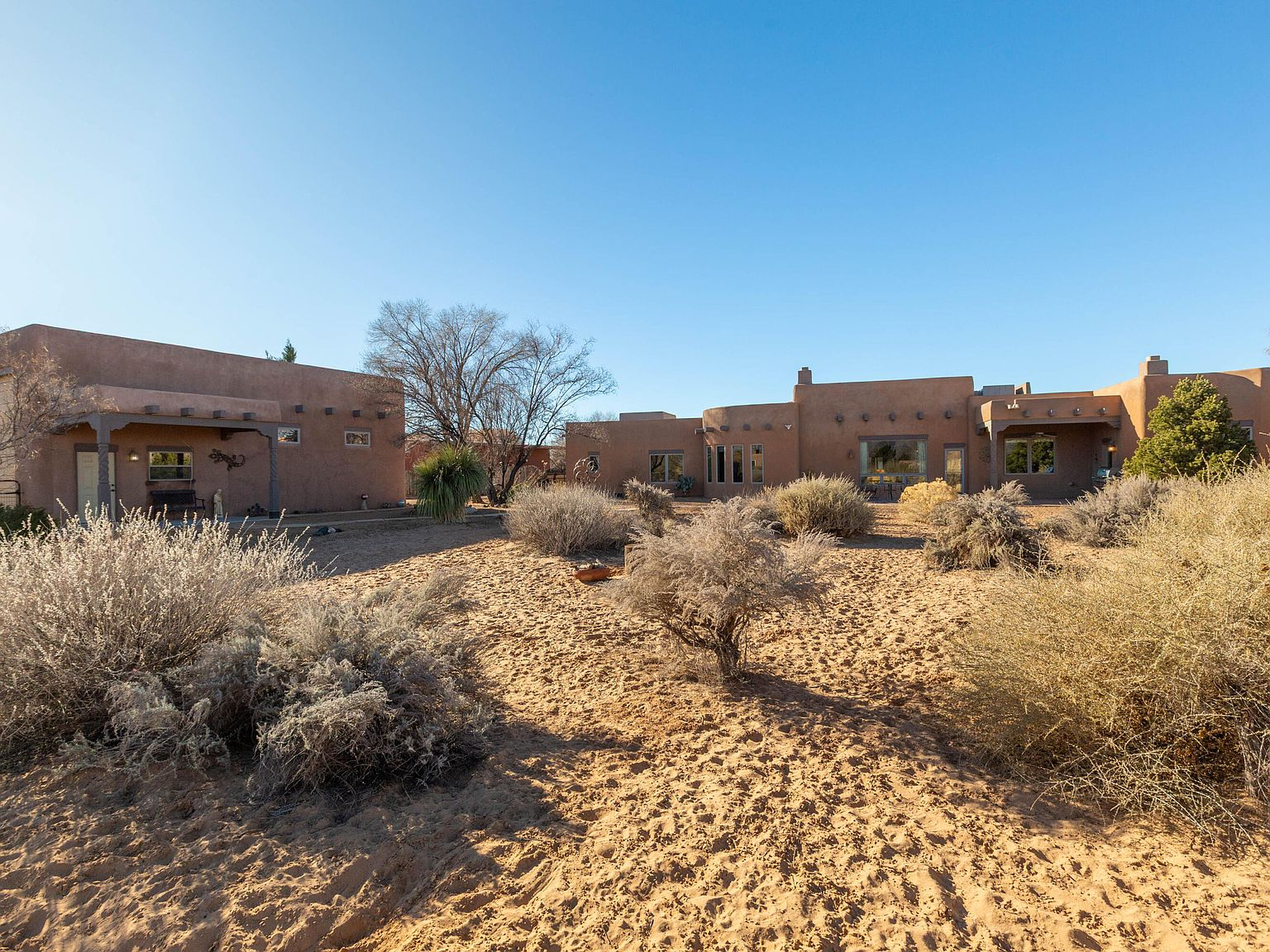 Desert backyard landscape with Pueblo architecture