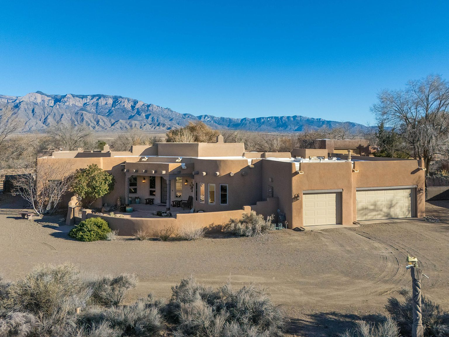 Front exterior with Sandia Mountain views in the background