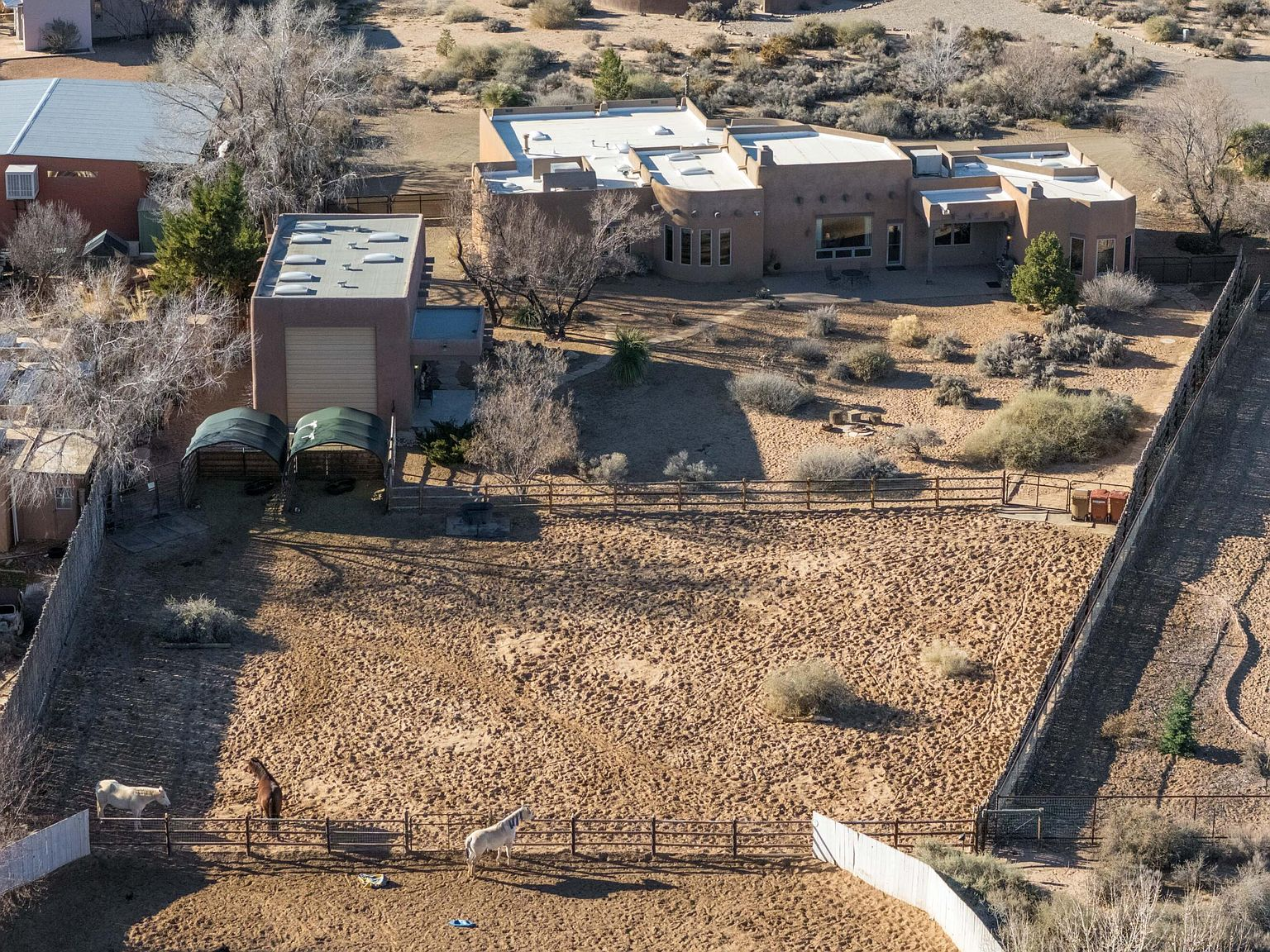 Aerial view of the horse property with corrals and desert landscape