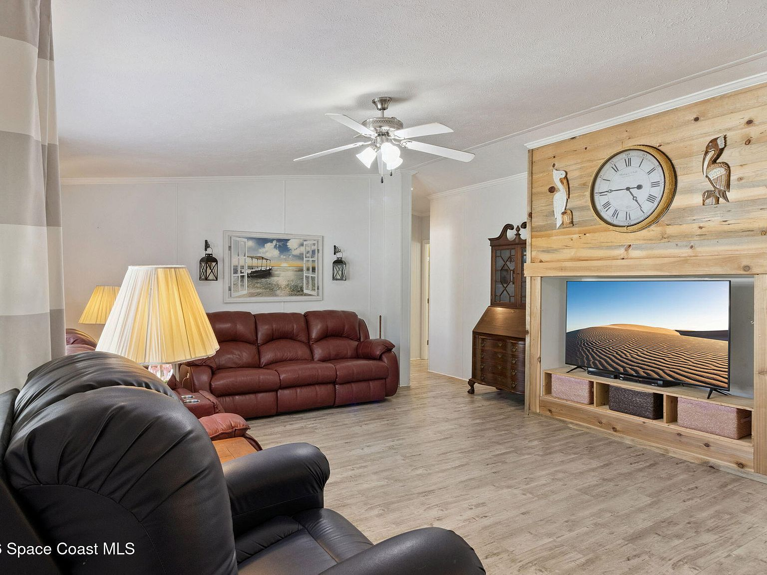 Living room with wood-plank accent wall and warm lighting