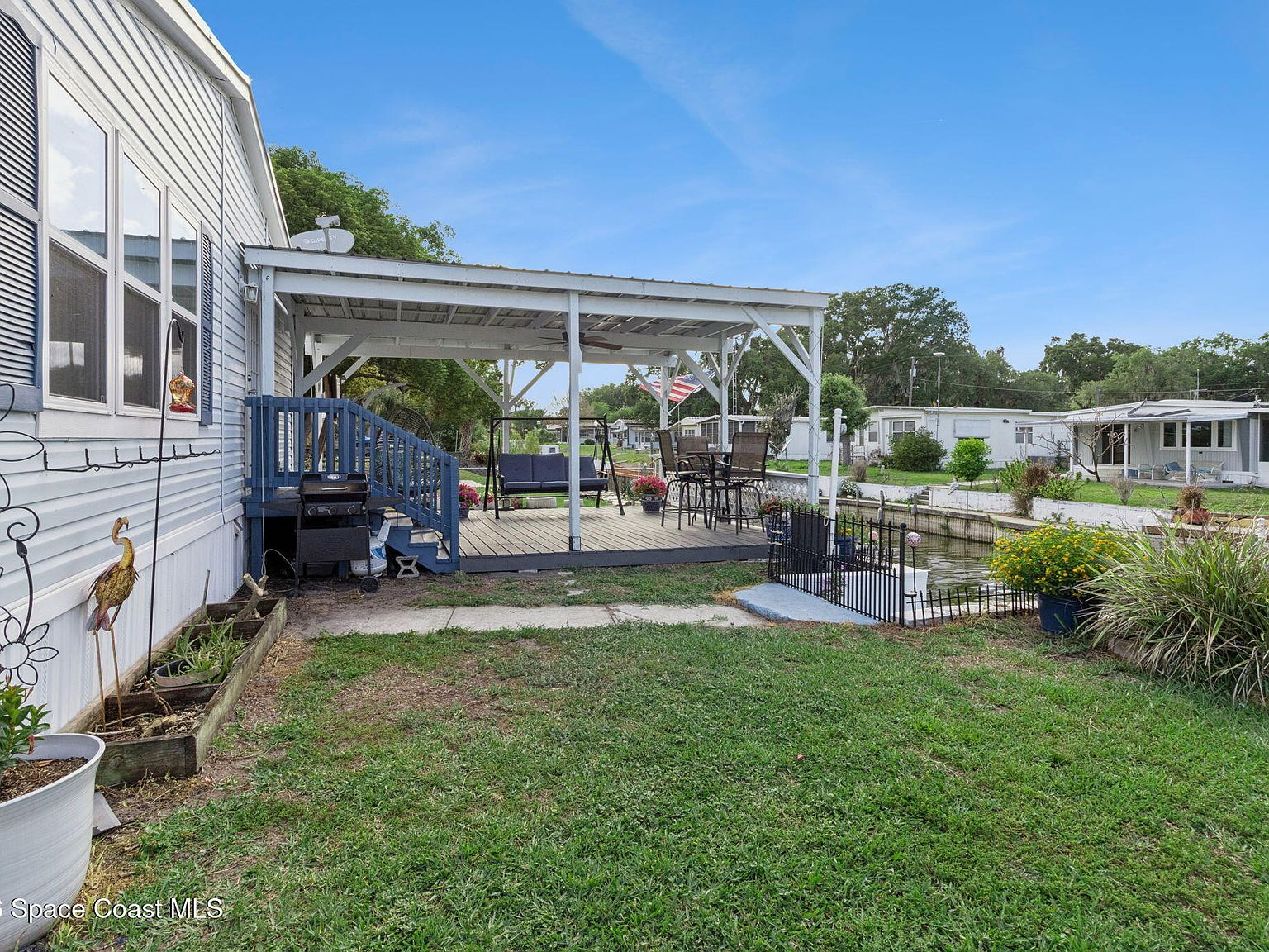 Exterior backyard shot of covered patio deck
