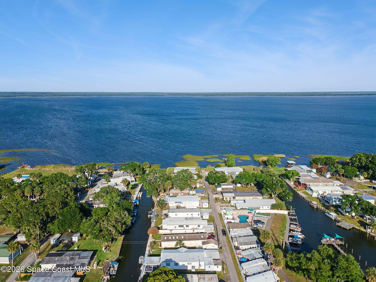 Aerial view of the canal-front community at 3100 Mark Ln in Lake Wales