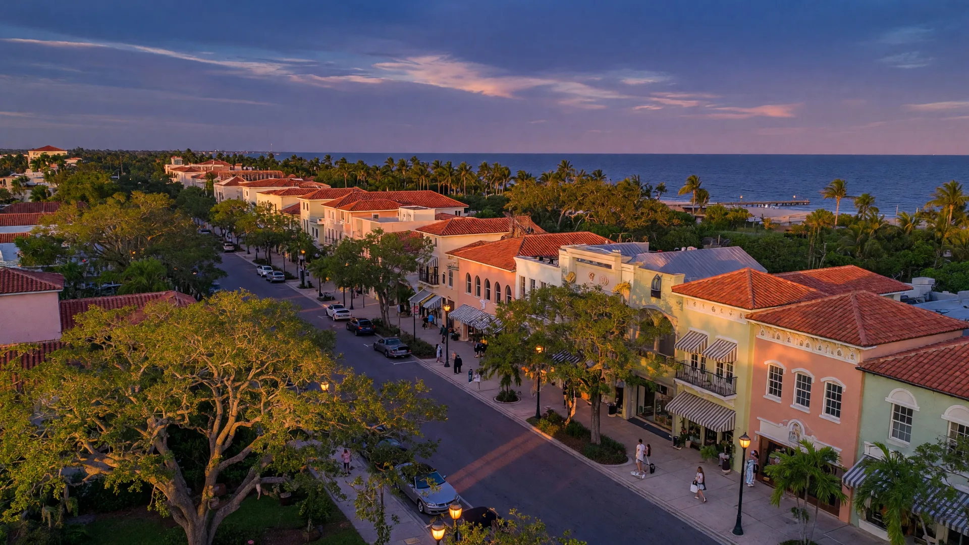 Aerial view of Venice Florida — historic downtown with Mediterranean Revival architecture along the Gulf Coast at golden hour