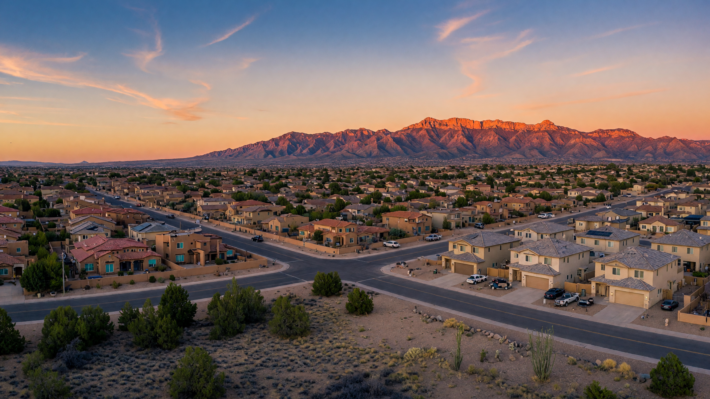 Aerial view of Rio Rancho, New Mexico with Sandia Mountains in the background at golden hour