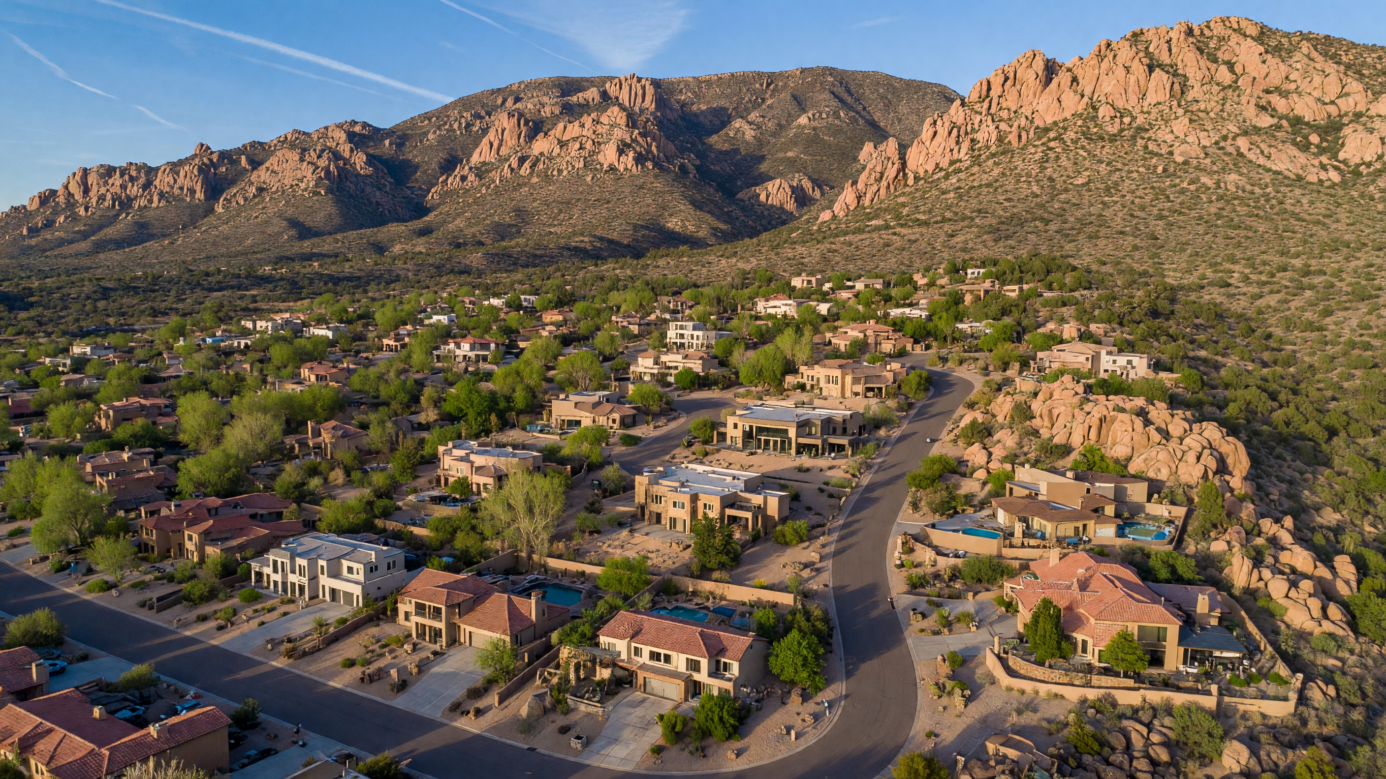 Aerial view of Four Hills Village, NM with Sandia Mountain backdrop