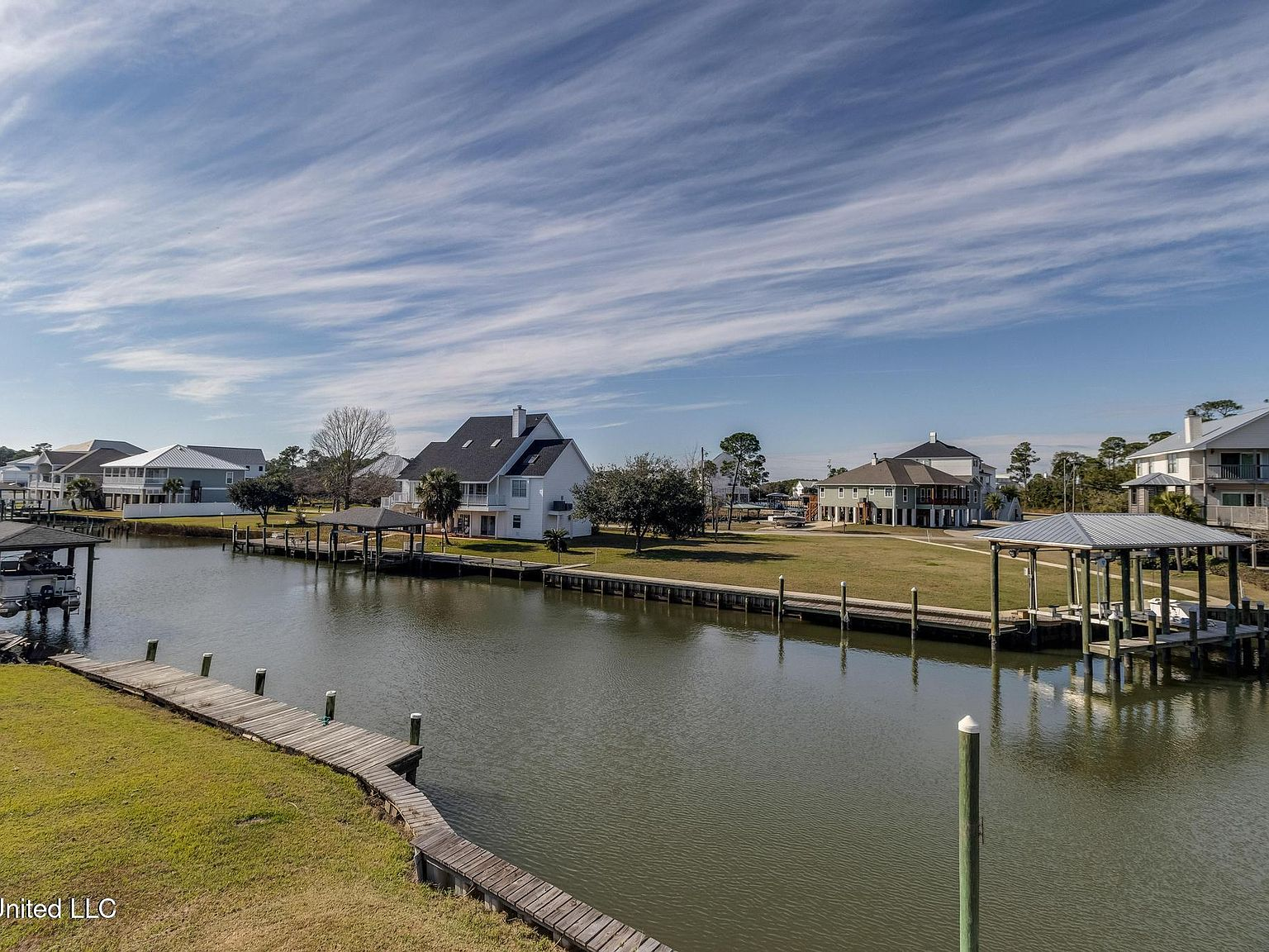 Elevated waterfront shot of the canal with coastal homes and private docks