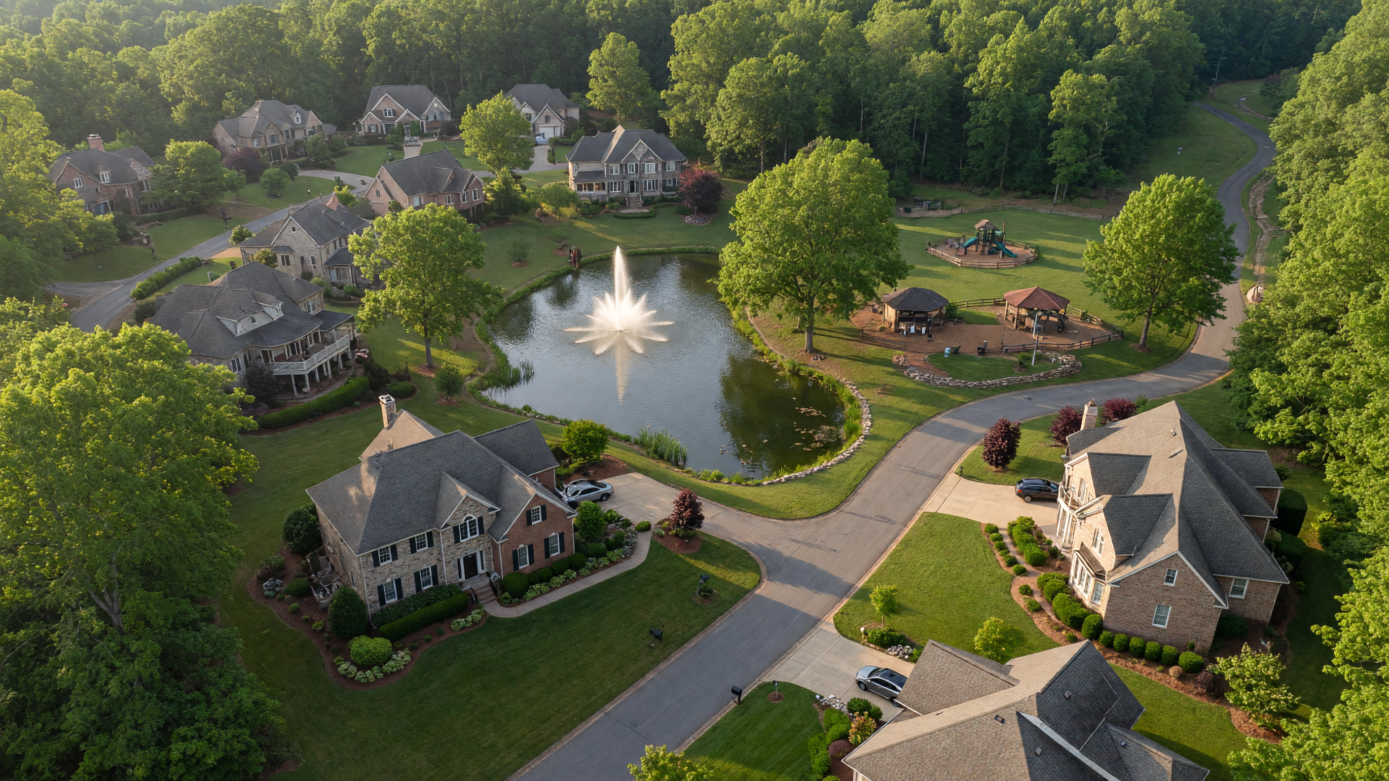 Sawhill neighborhood in Spotsylvania County Virginia — upscale custom estate homes on large wooded lots, scenic pond, neighborhood park, bordered by park land in the Riverbend District