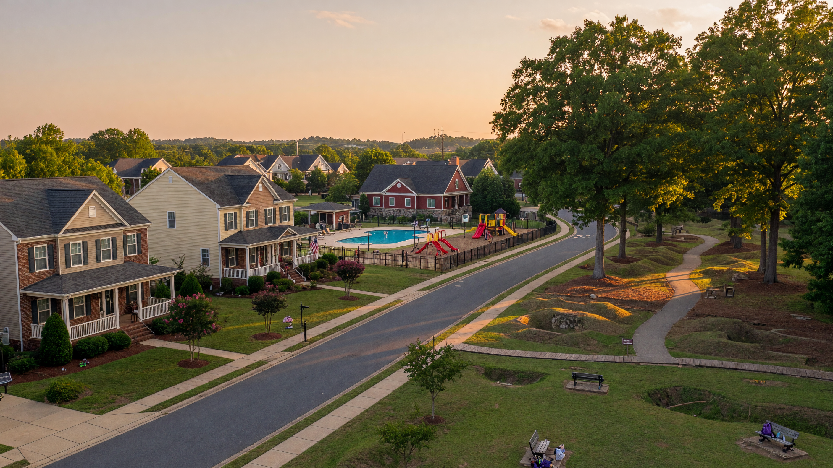 Pelham's Crossing neighborhood in Spotsylvania County Virginia — craftsman and colonial single-family homes, community clubhouse, pool, walking trails through preserved conservation land with Civil War earthworks