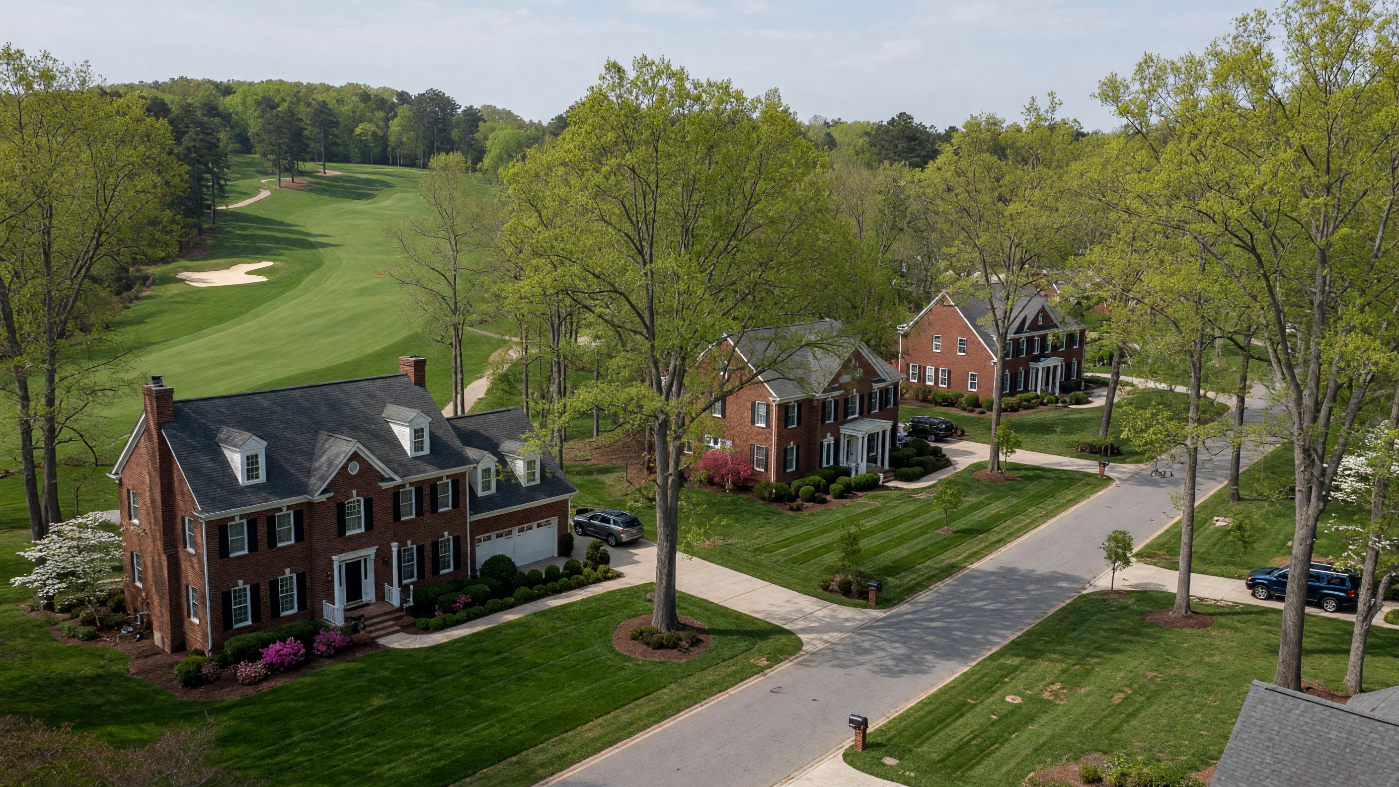 Augustine North upscale golf-course community in Stafford Virginia — custom Colonial homes on wooded lots with the Augustine Golf Course fairway in the background