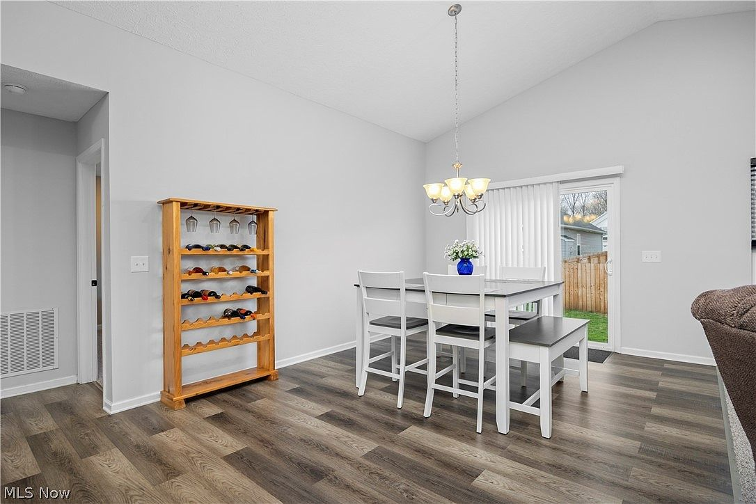 Dining area with chandelier and sliding patio door