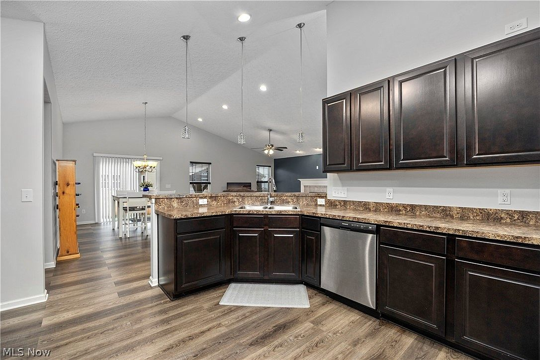 Kitchen looking into dining and living spaces, open concept