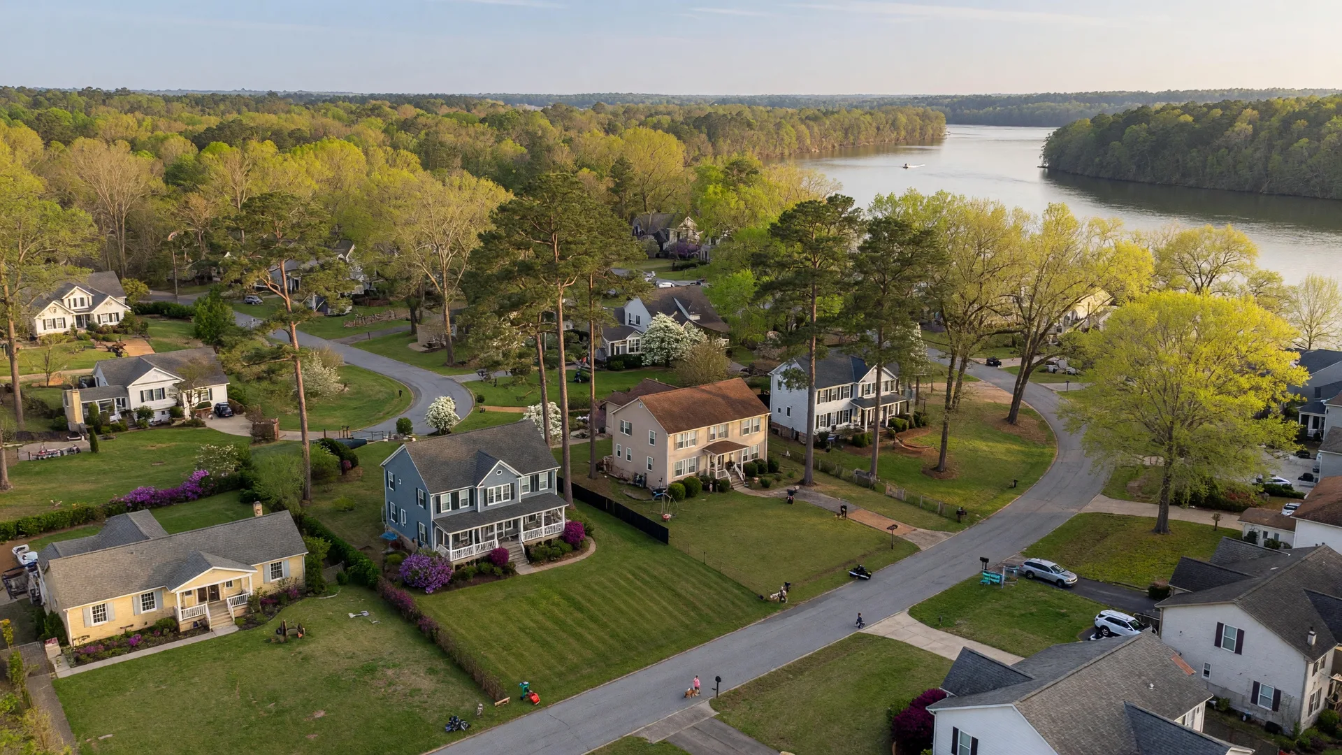 Tree-lined residential neighborhood in North Augusta SC with spacious yards and family homes on a sunny afternoon