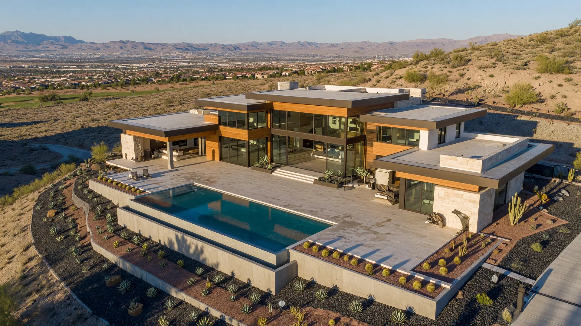 Contemporary luxury mansion in the hills of Henderson with glass walls, infinity pool, and valley views