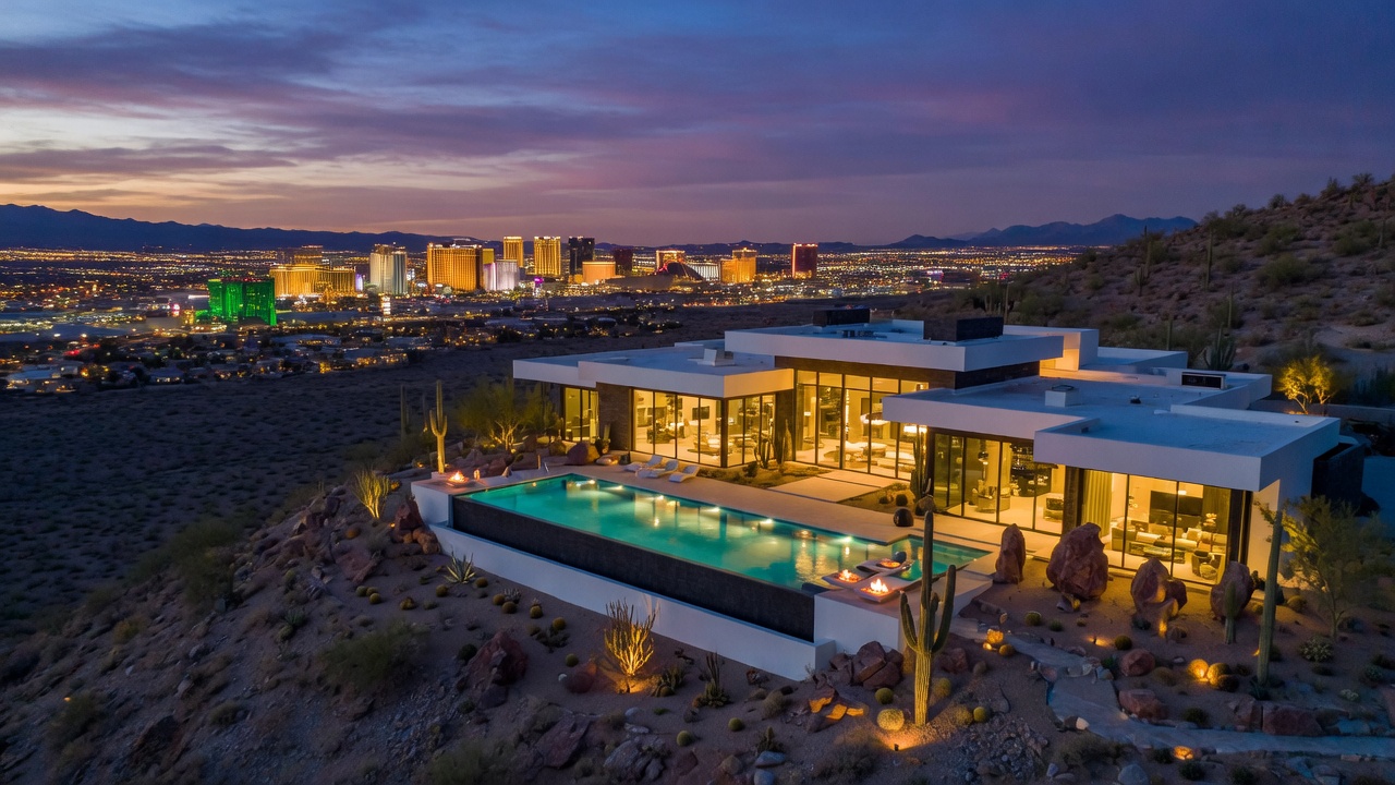 Luxury desert estate in Henderson with infinity pool and Las Vegas Strip views at twilight