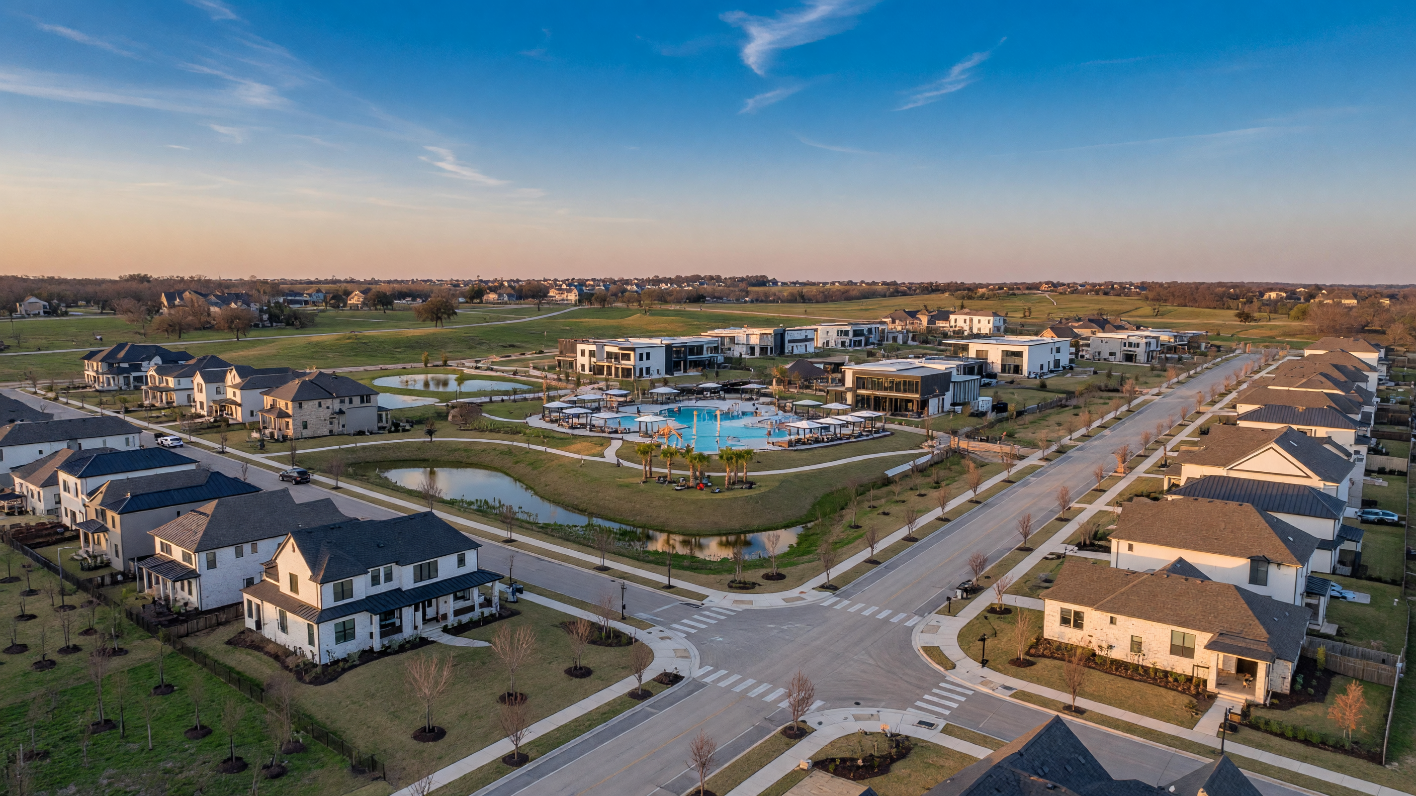 Aerial view of Pecan Square master-planned community in Northlake, Texas showing village center and homes