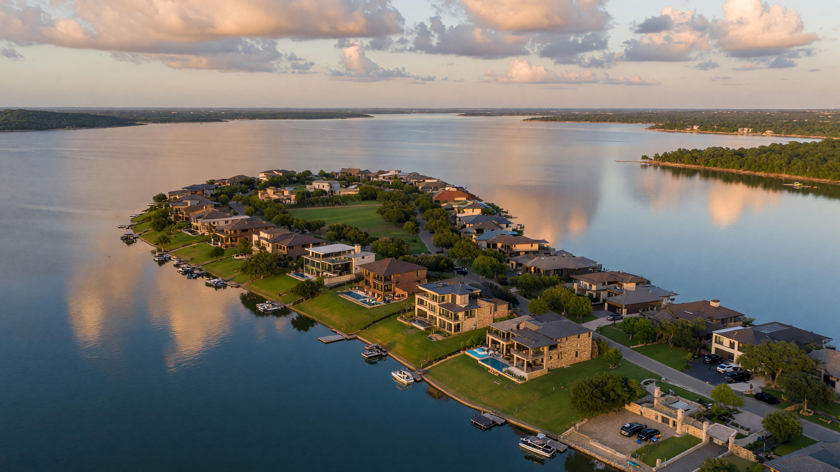 Aerial view of Sycamore Cove lakeside community on a peninsula in Lake Lewisville, Hickory Creek, Texas