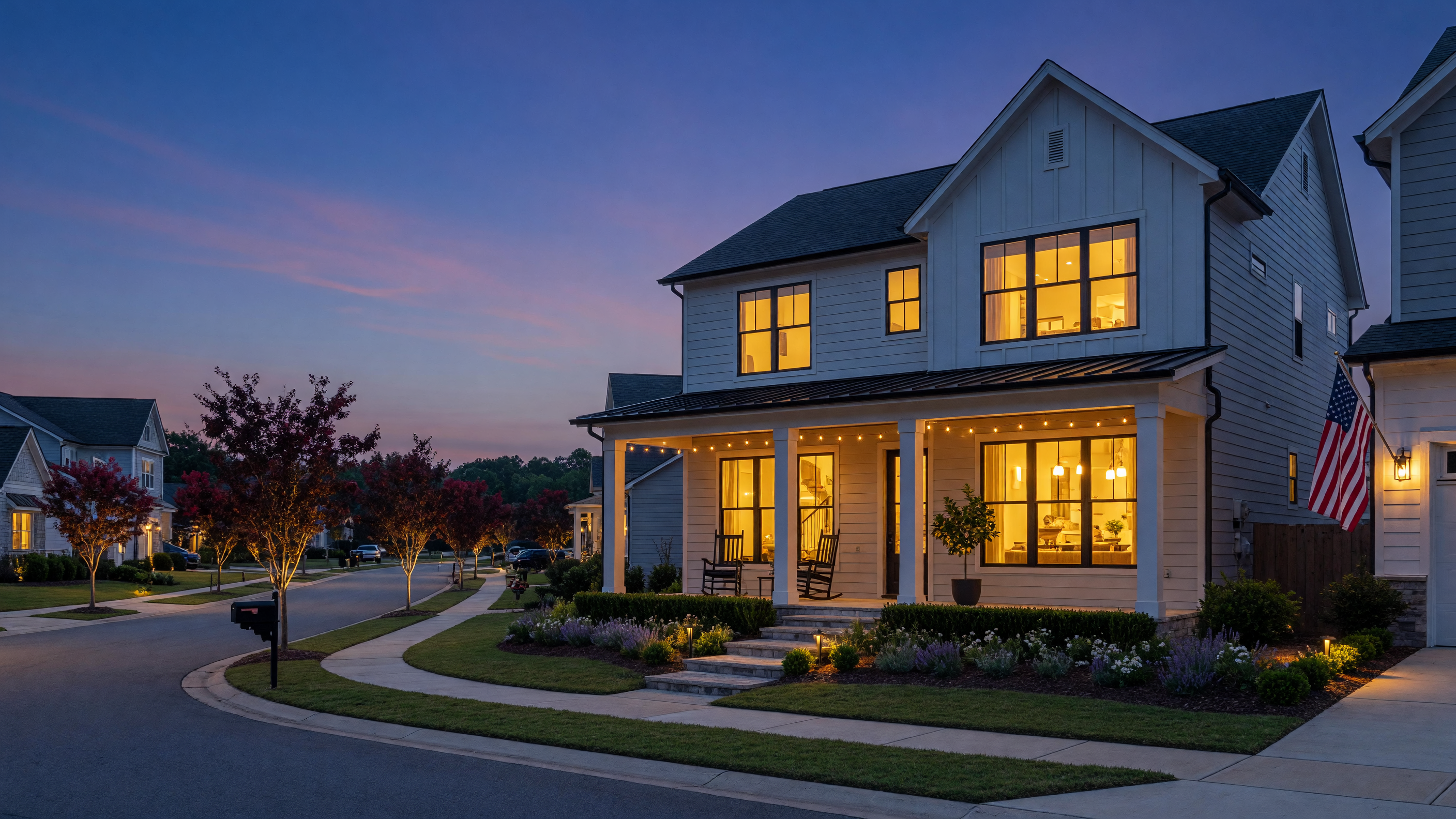 Modern home in North Texas at dusk with warm welcoming lights