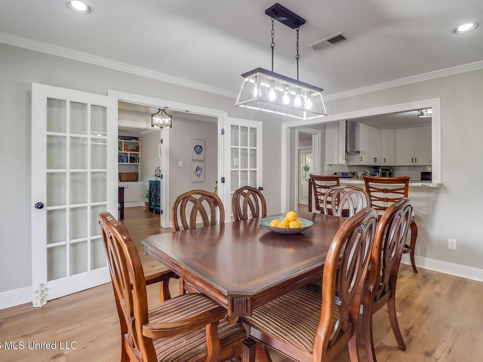 Dining room with French doors and recessed lighting