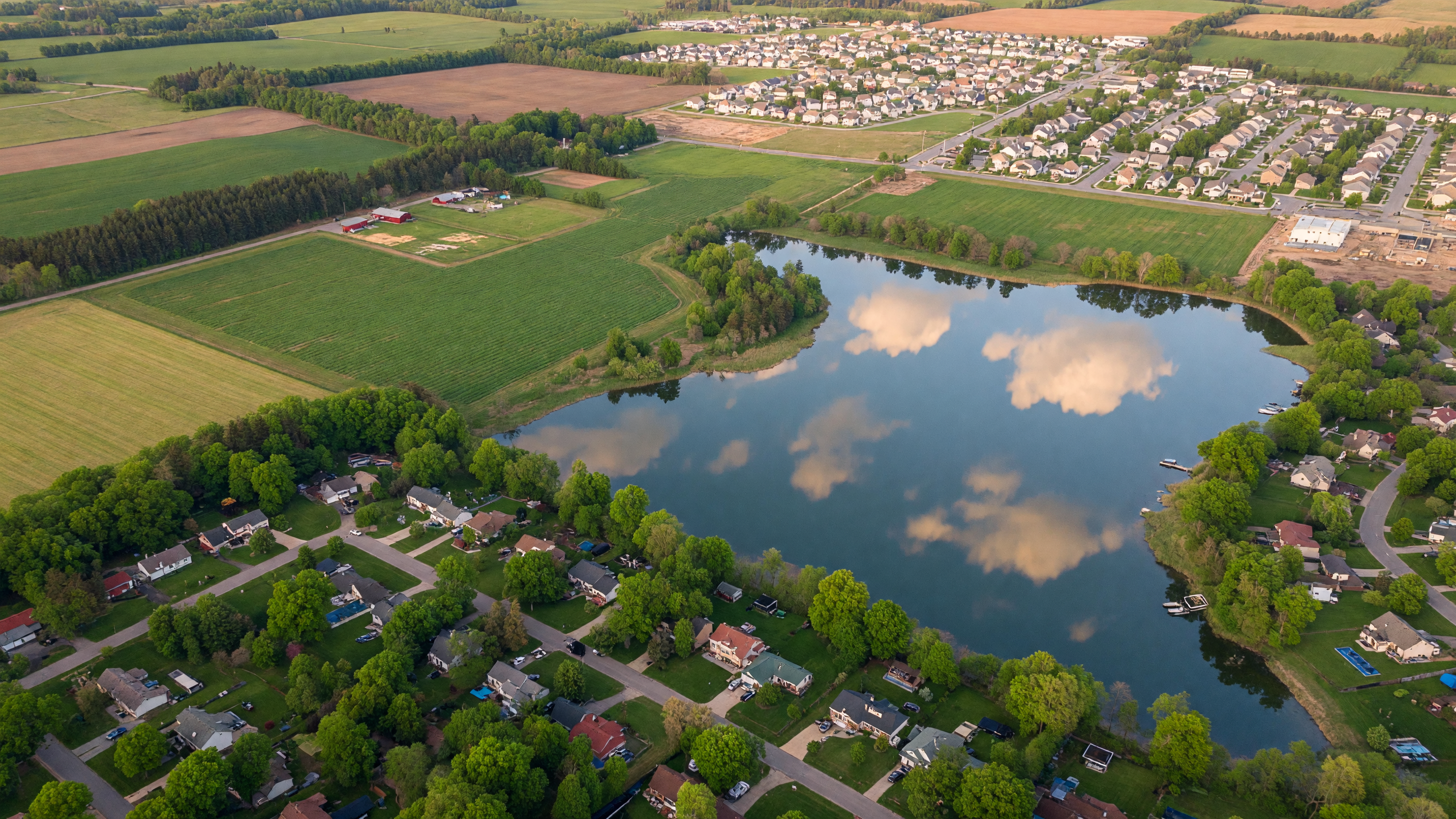 Aerial view of Livingston County Michigan communities, lakes, and tree-lined neighborhoods