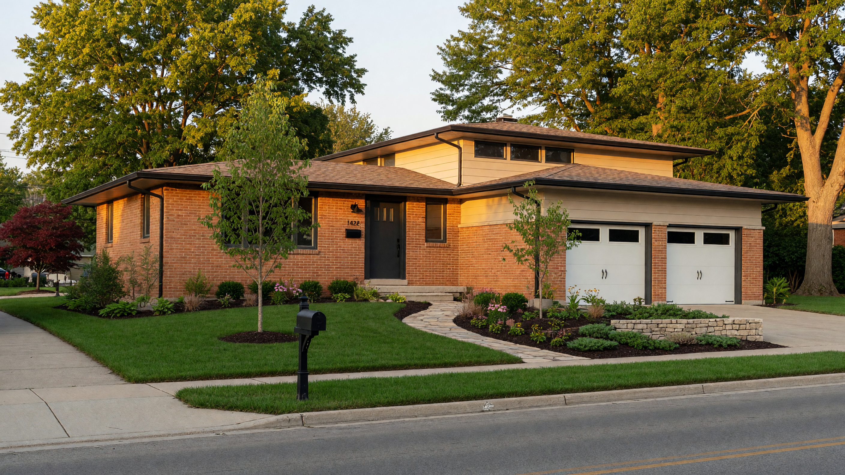 A beautifully remodeled Michigan home showing fresh curb appeal with new landscaping and updated exterior