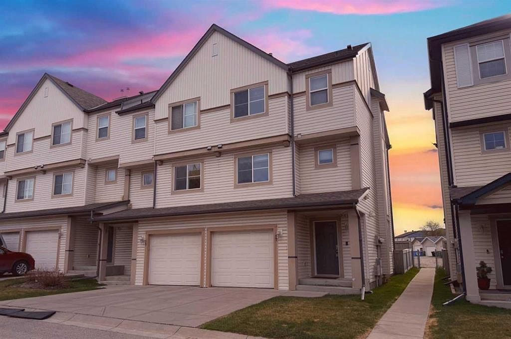 Exterior facade of 17 Copperfield Court SE (Copperfield, Calgary) at twilight with dramatic sky