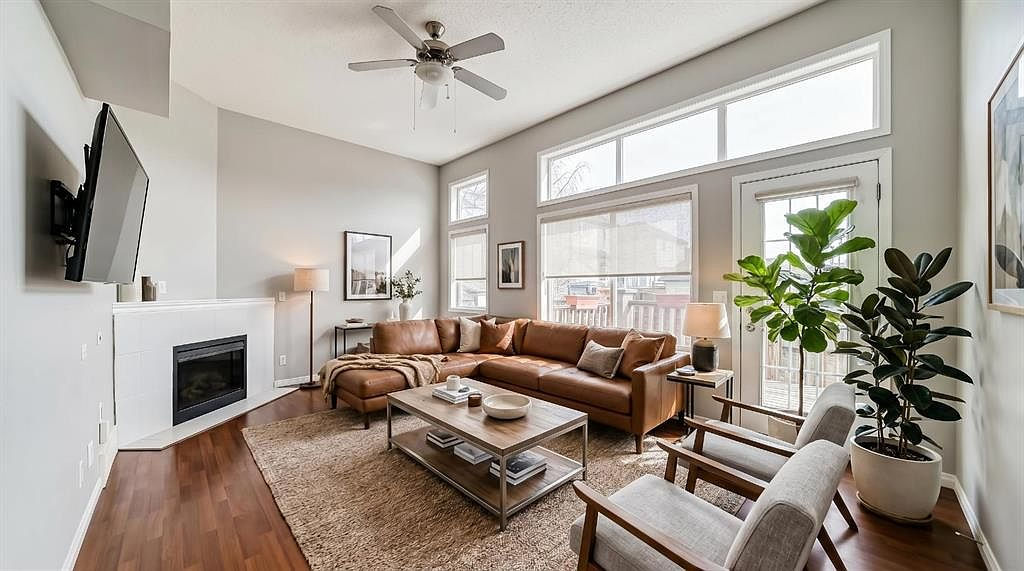 Living room with 12-foot ceilings and fireplace