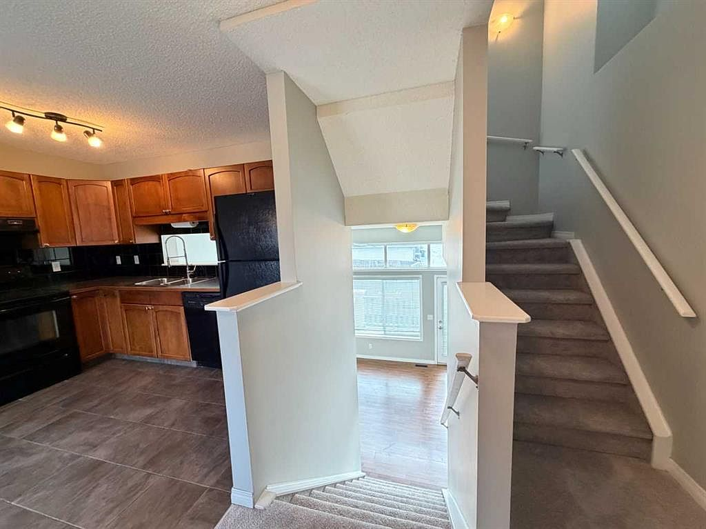 Split-level stairs and kitchen view