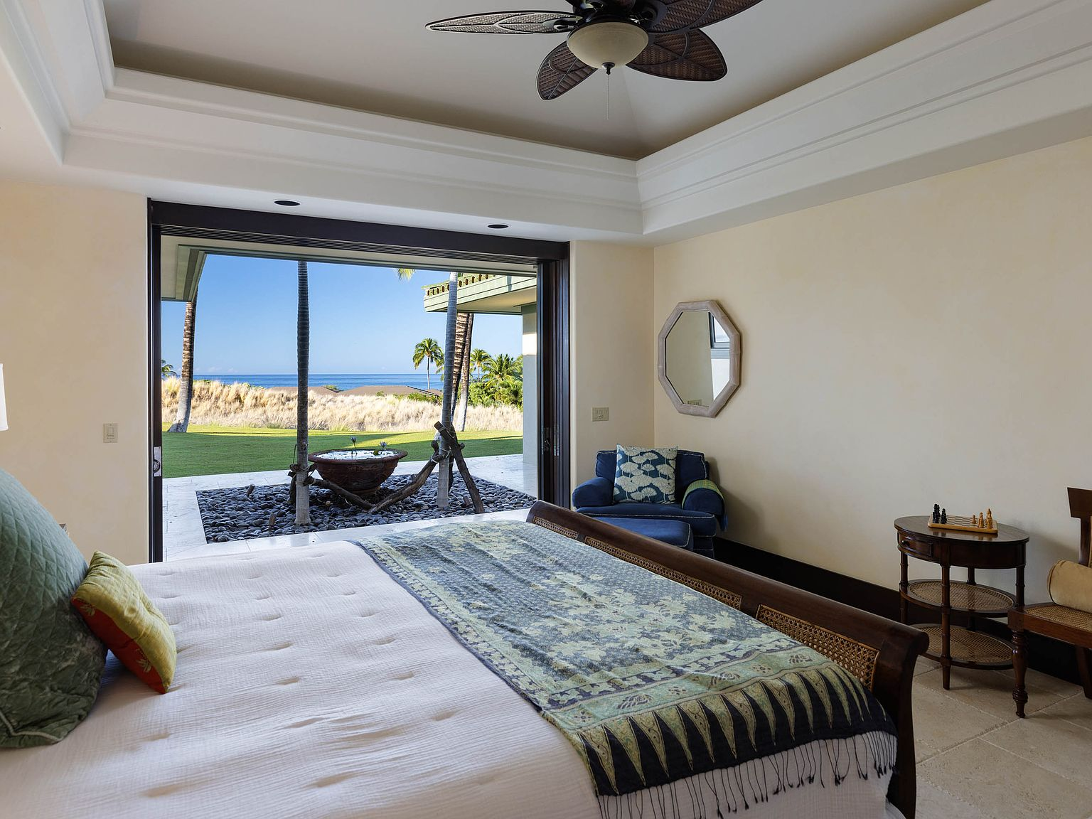 Master bedroom with pocket doors fully retracted to lawn and ocean view