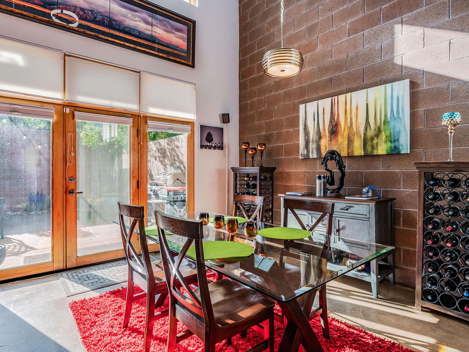 Dining room with cinderblock wall and large glass patio doors