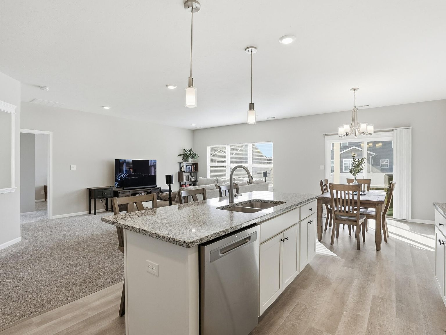 Open-concept kitchen, dining, and living area